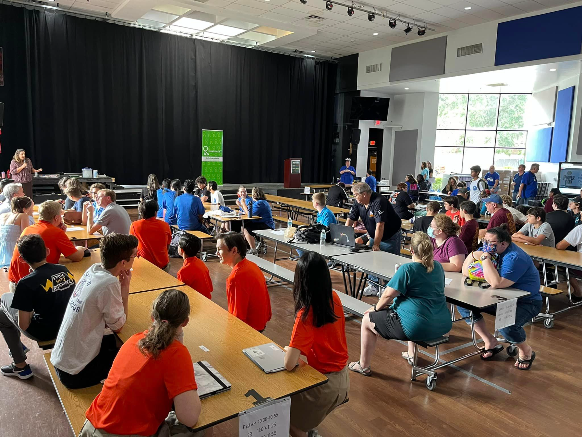 a group of people sitting at tables
