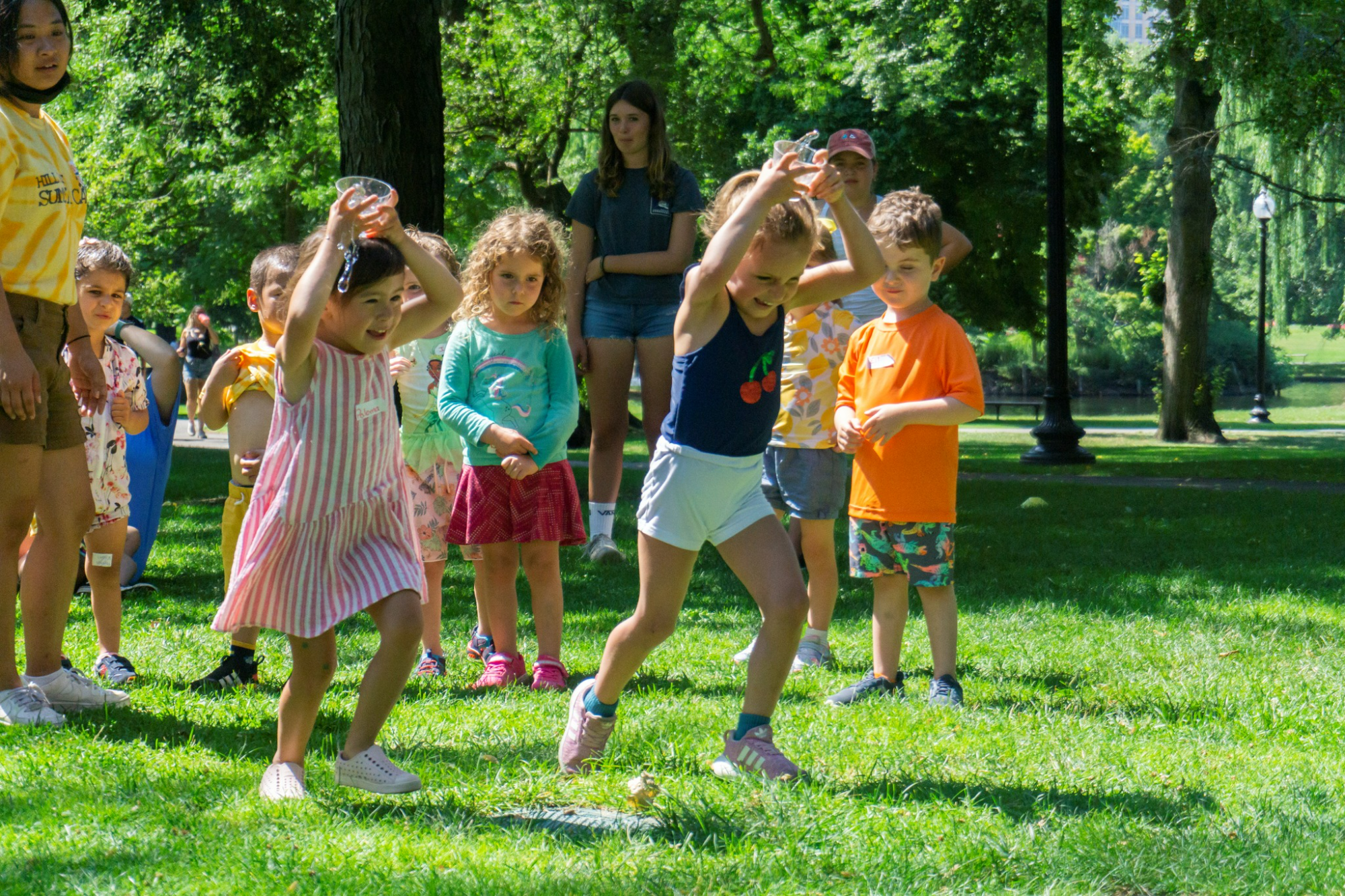 a group of children playing with bubbles