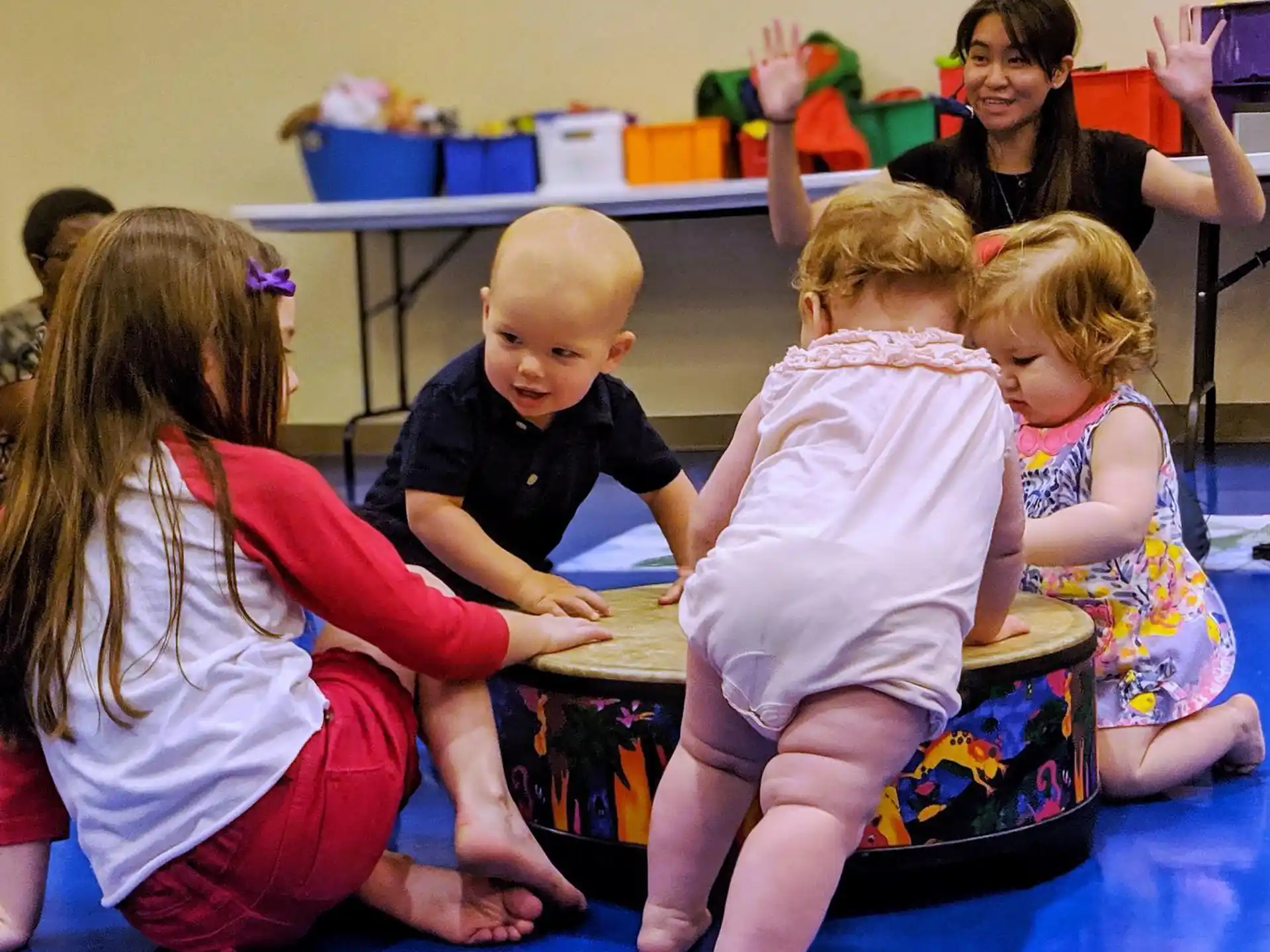 a group of children sitting on the floor