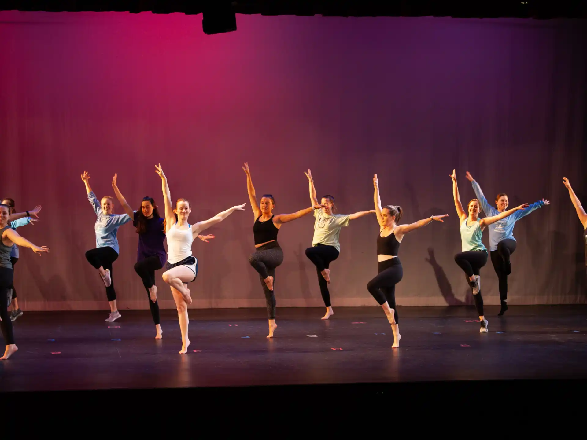 a group of women dancing on a stage