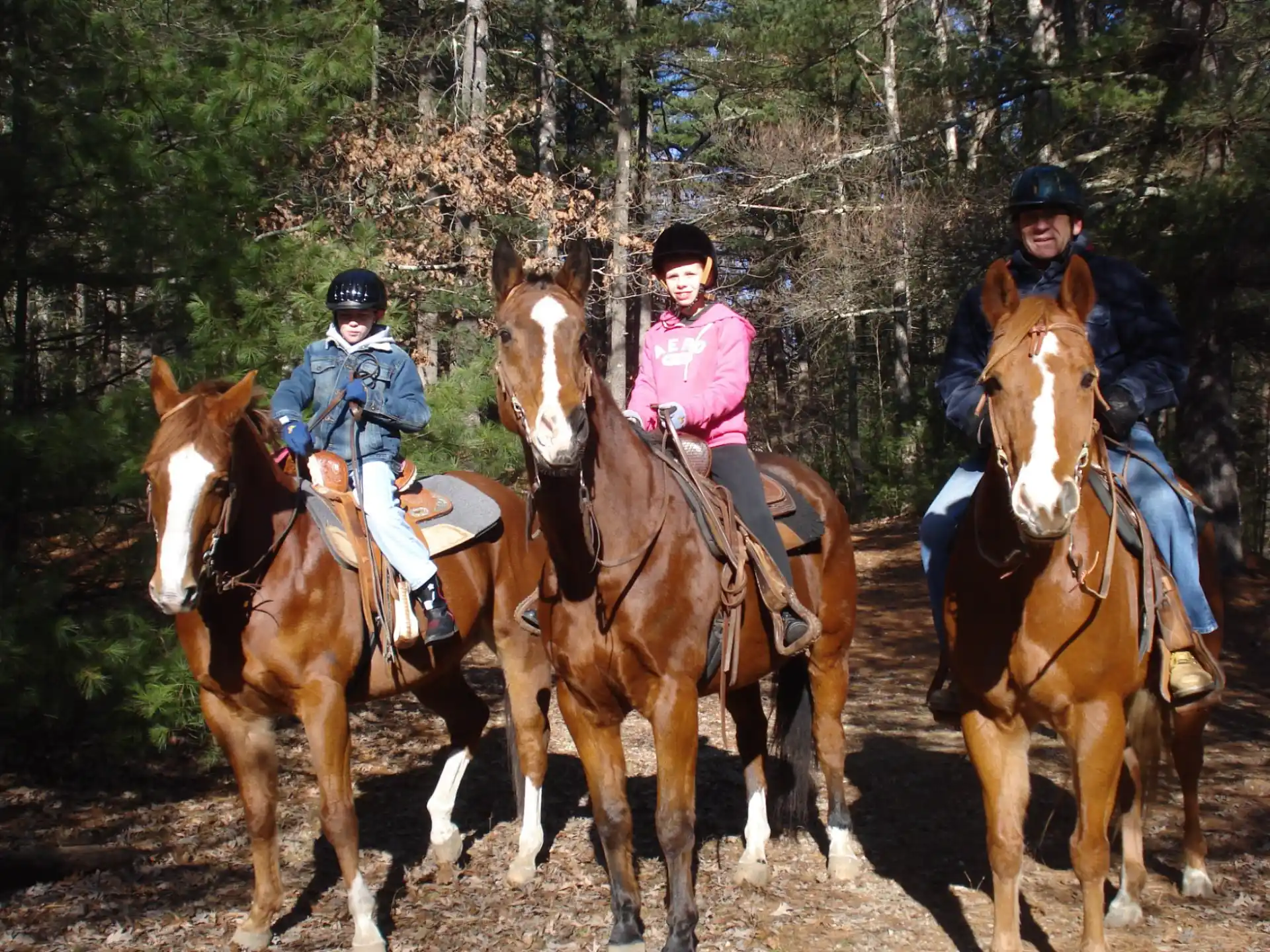 a group of people riding horses