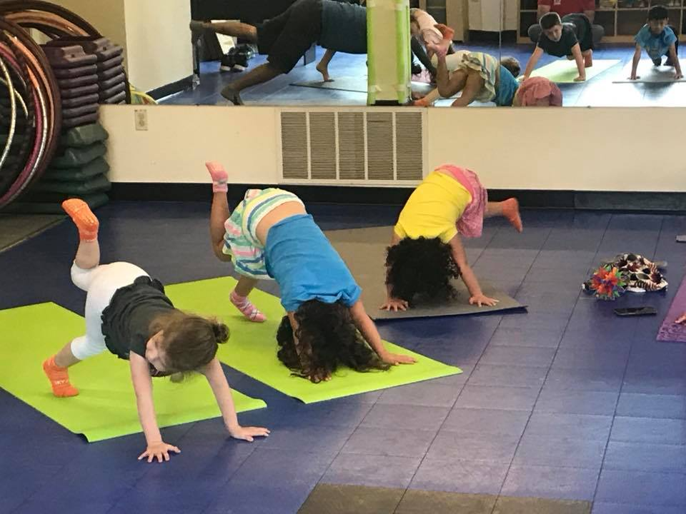 a group of women doing yoga
