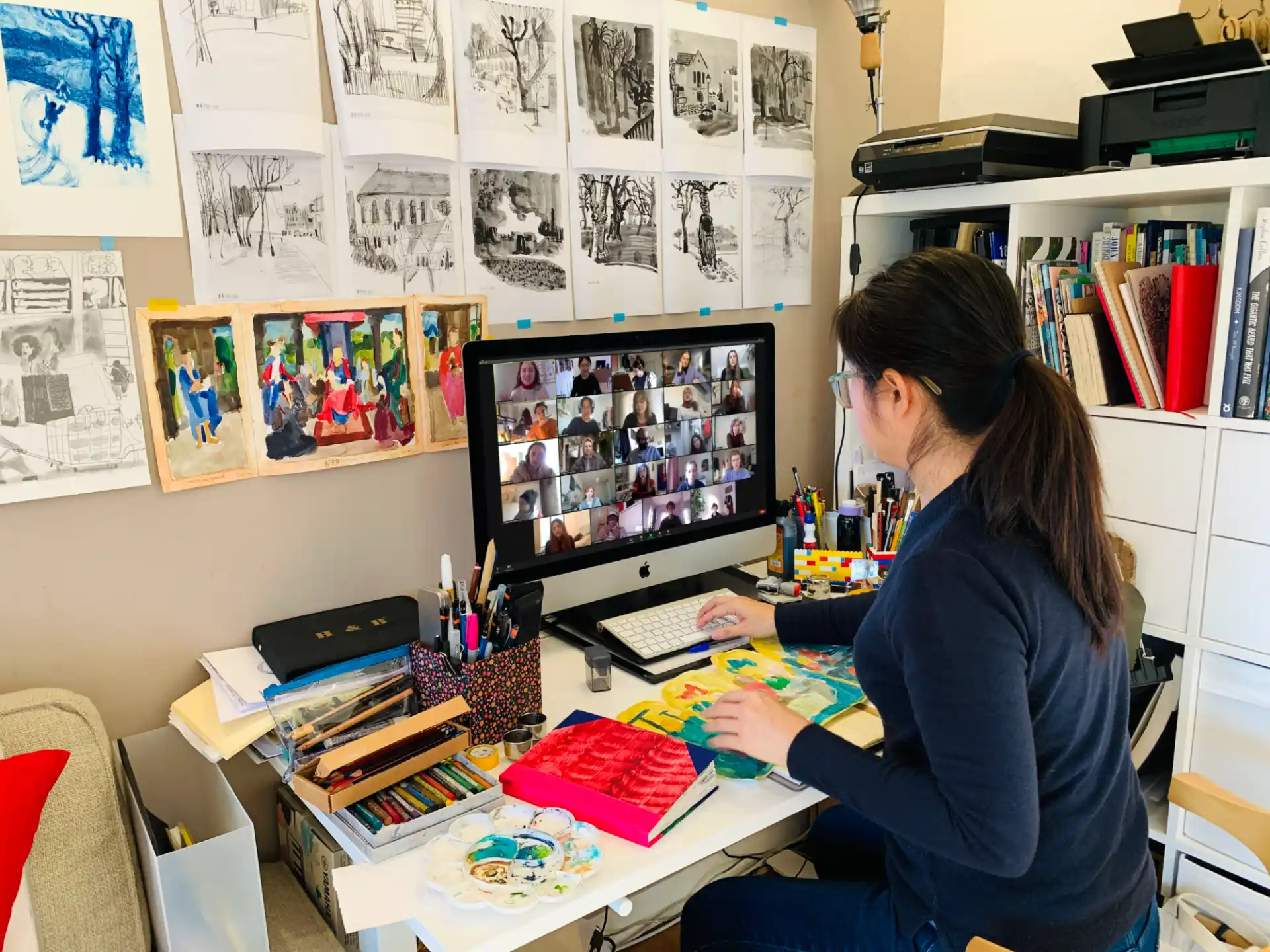 a person sitting at a desk with a computer