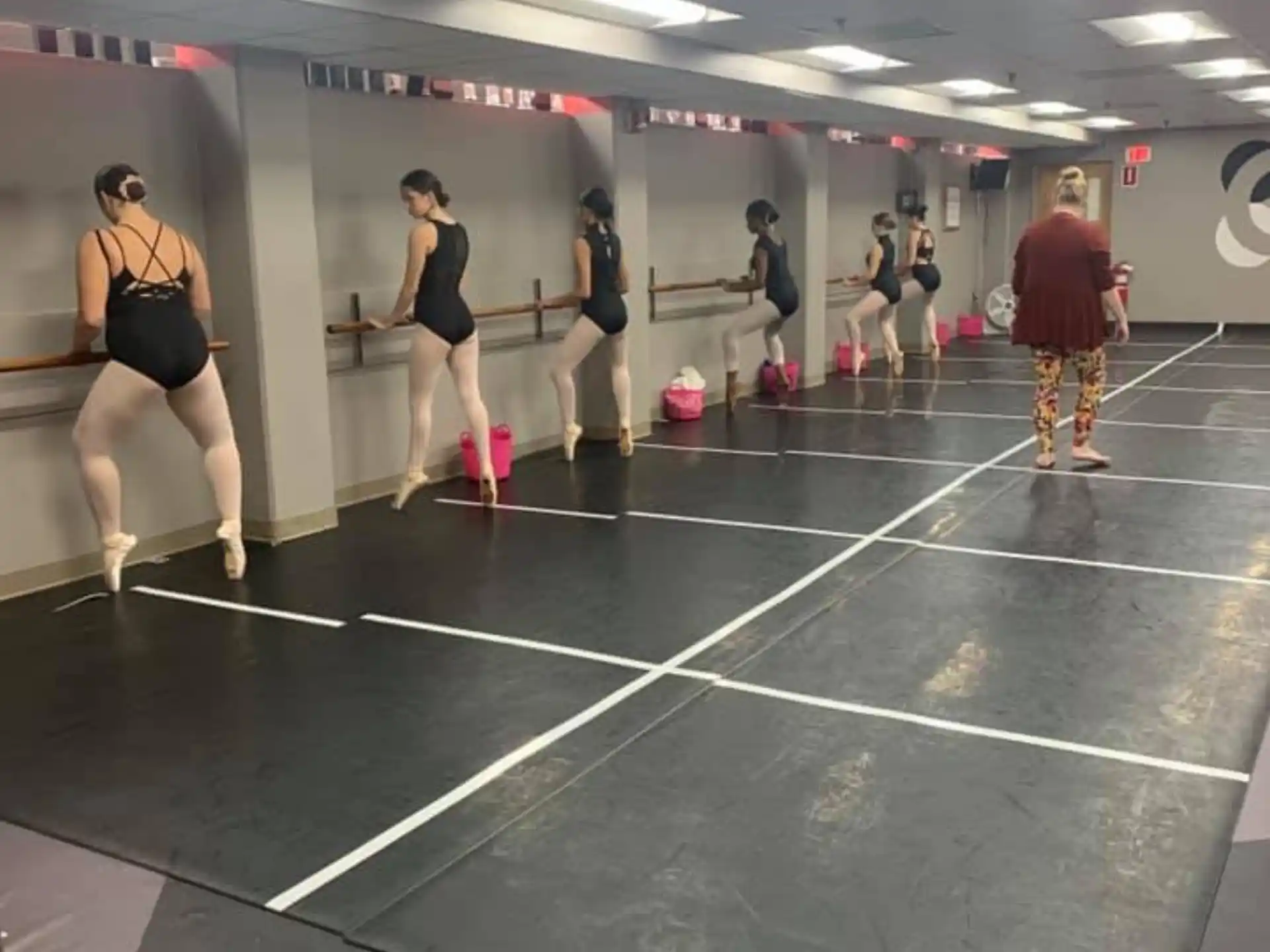 a group of people exercising in a gym