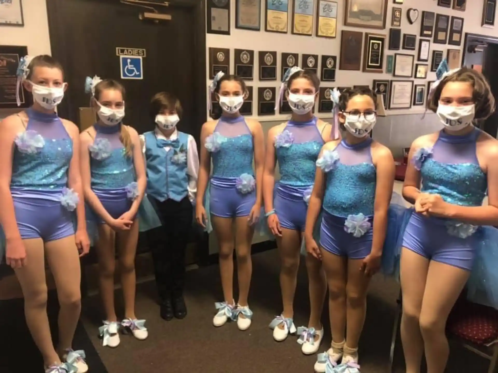 a group of girls in blue uniforms