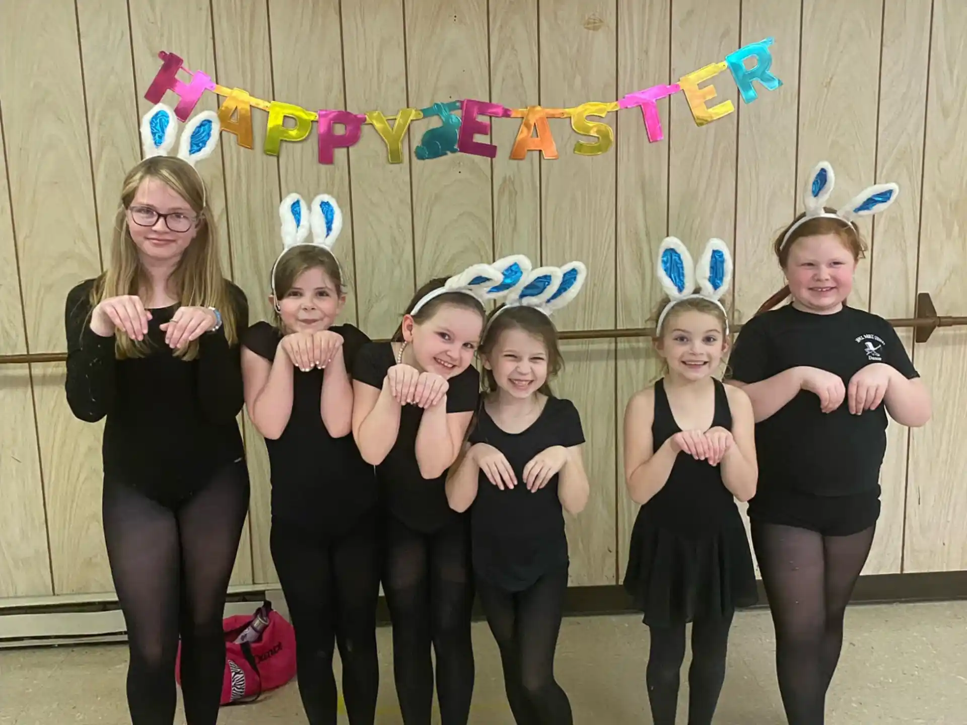 a group of girls posing for a picture