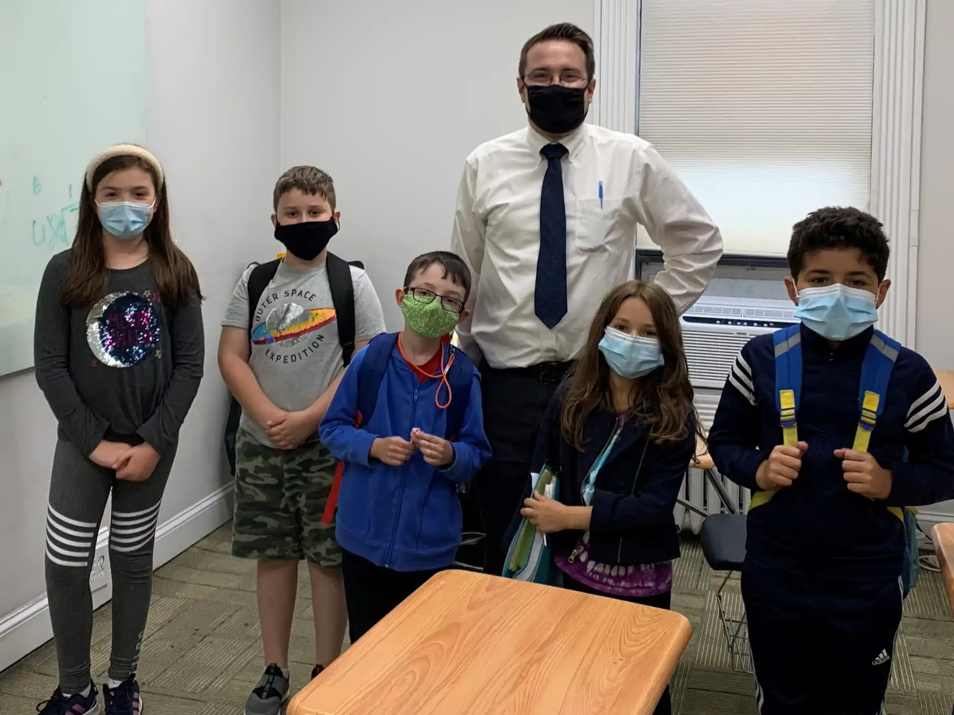 a group of people wearing masks