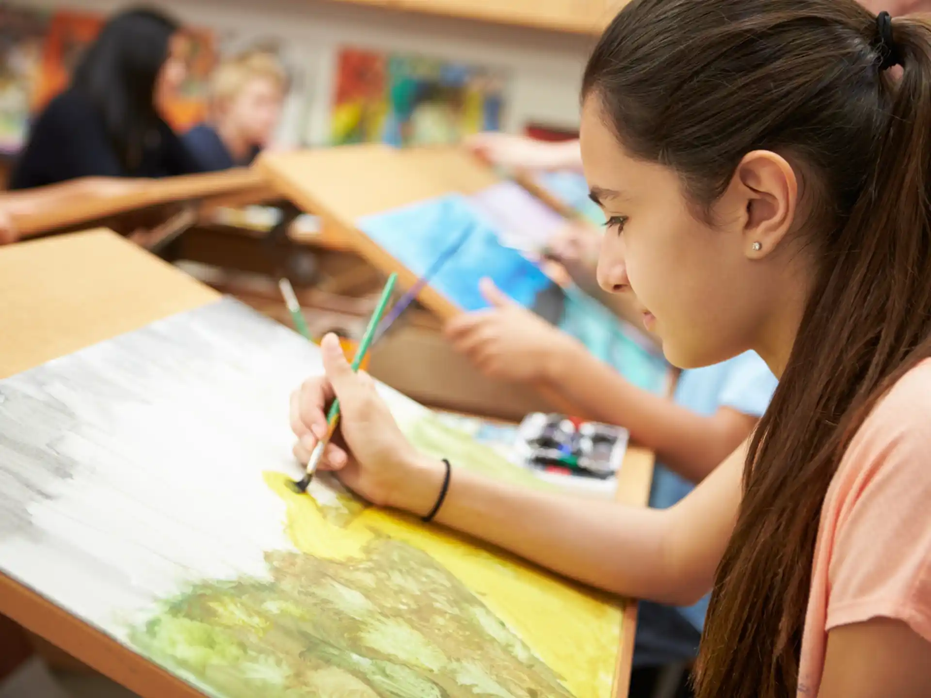 a young girl painting