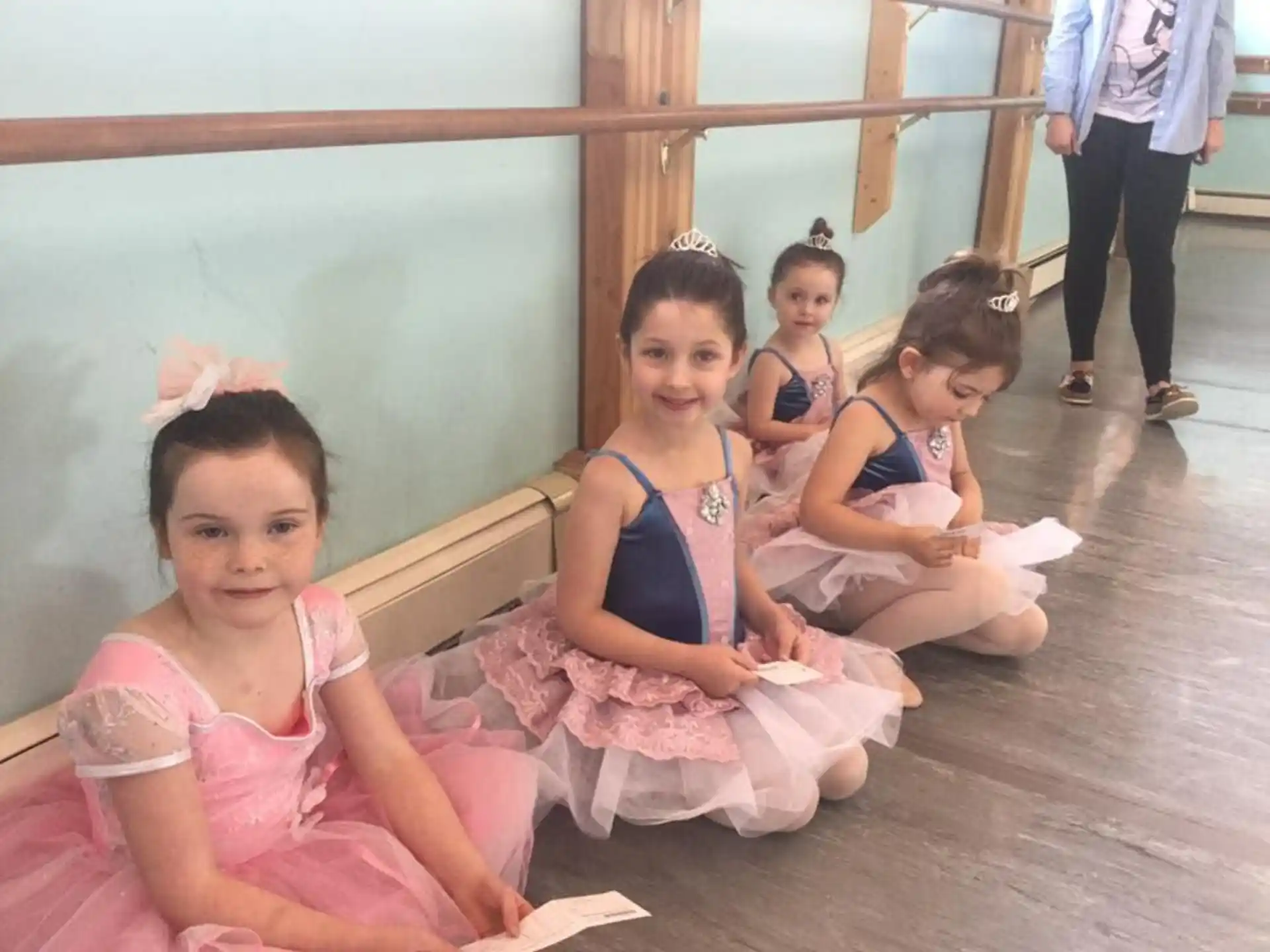 a group of girls sitting on the floor