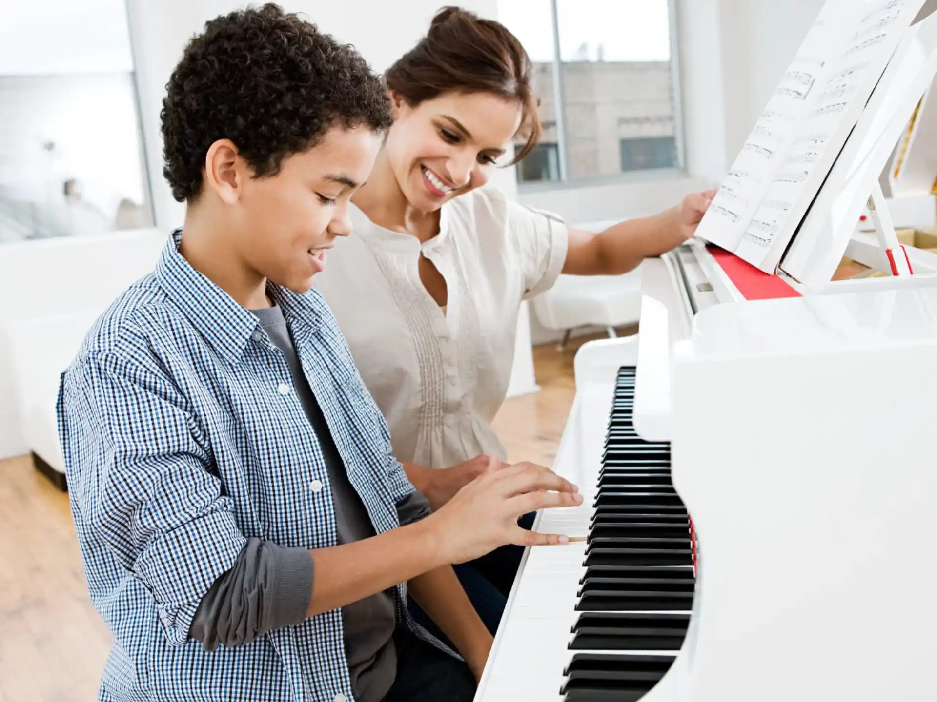 a man and a woman looking at a computer