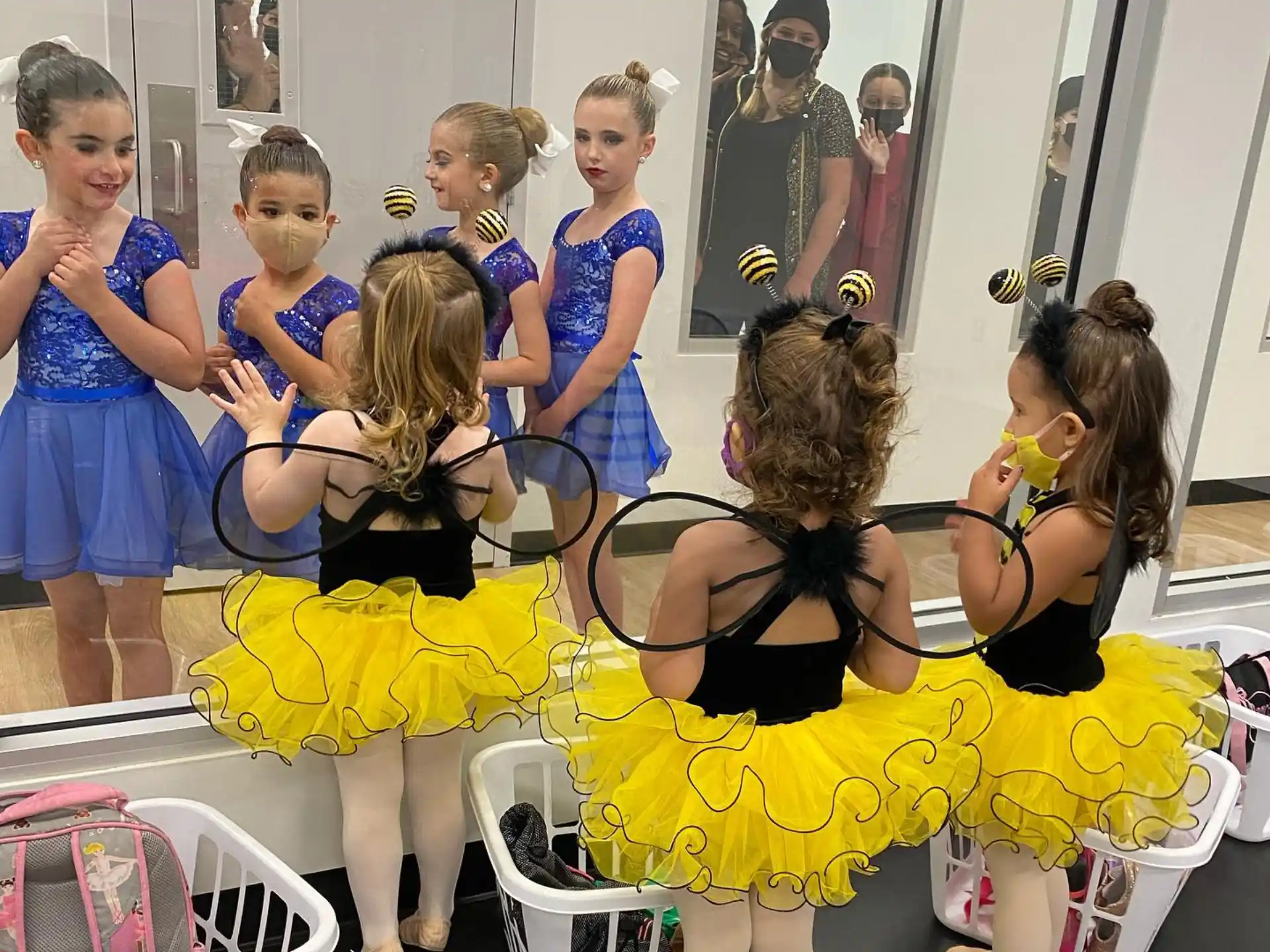 a group of girls in dresses