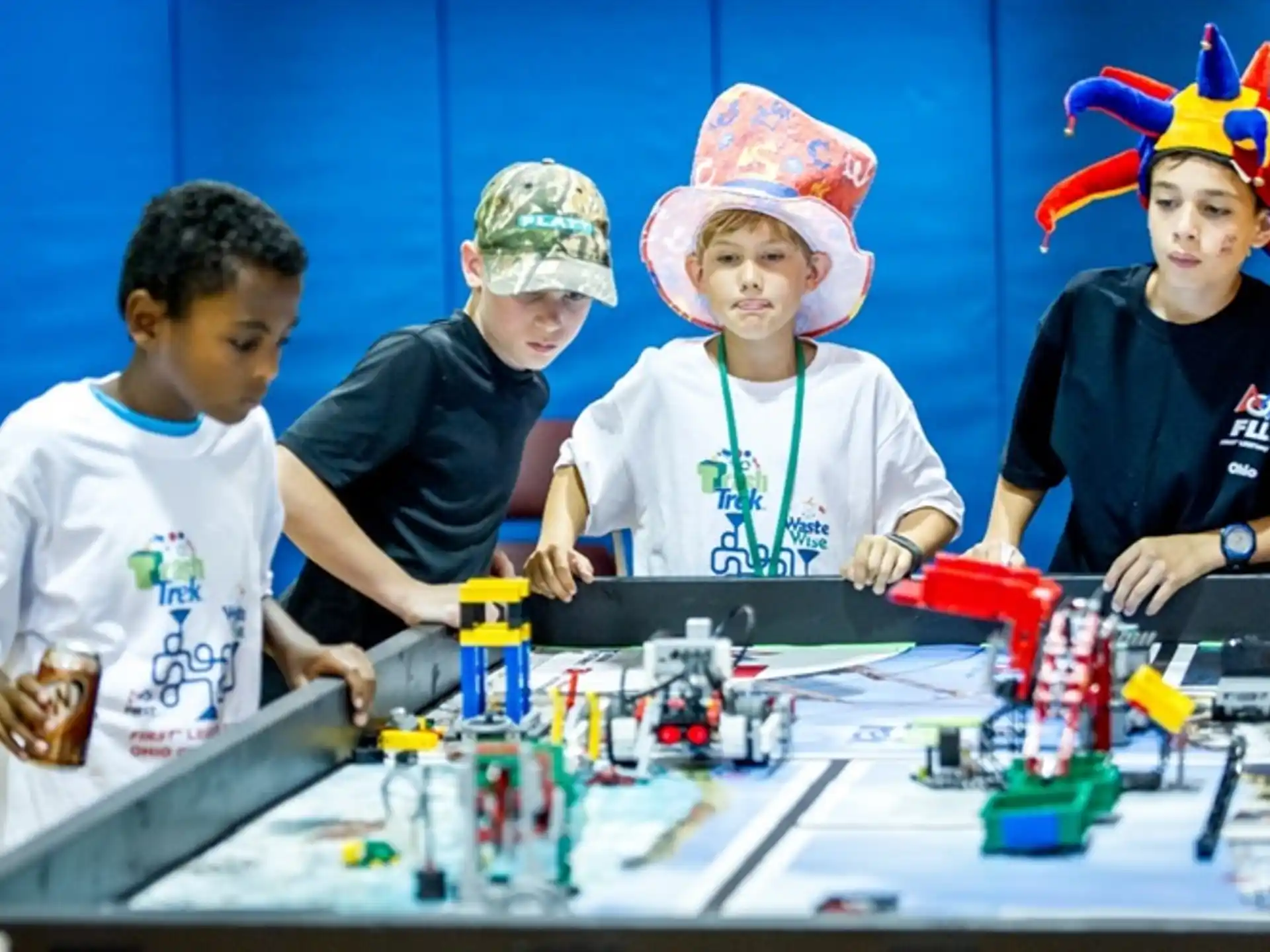 a group of kids playing with building blocks