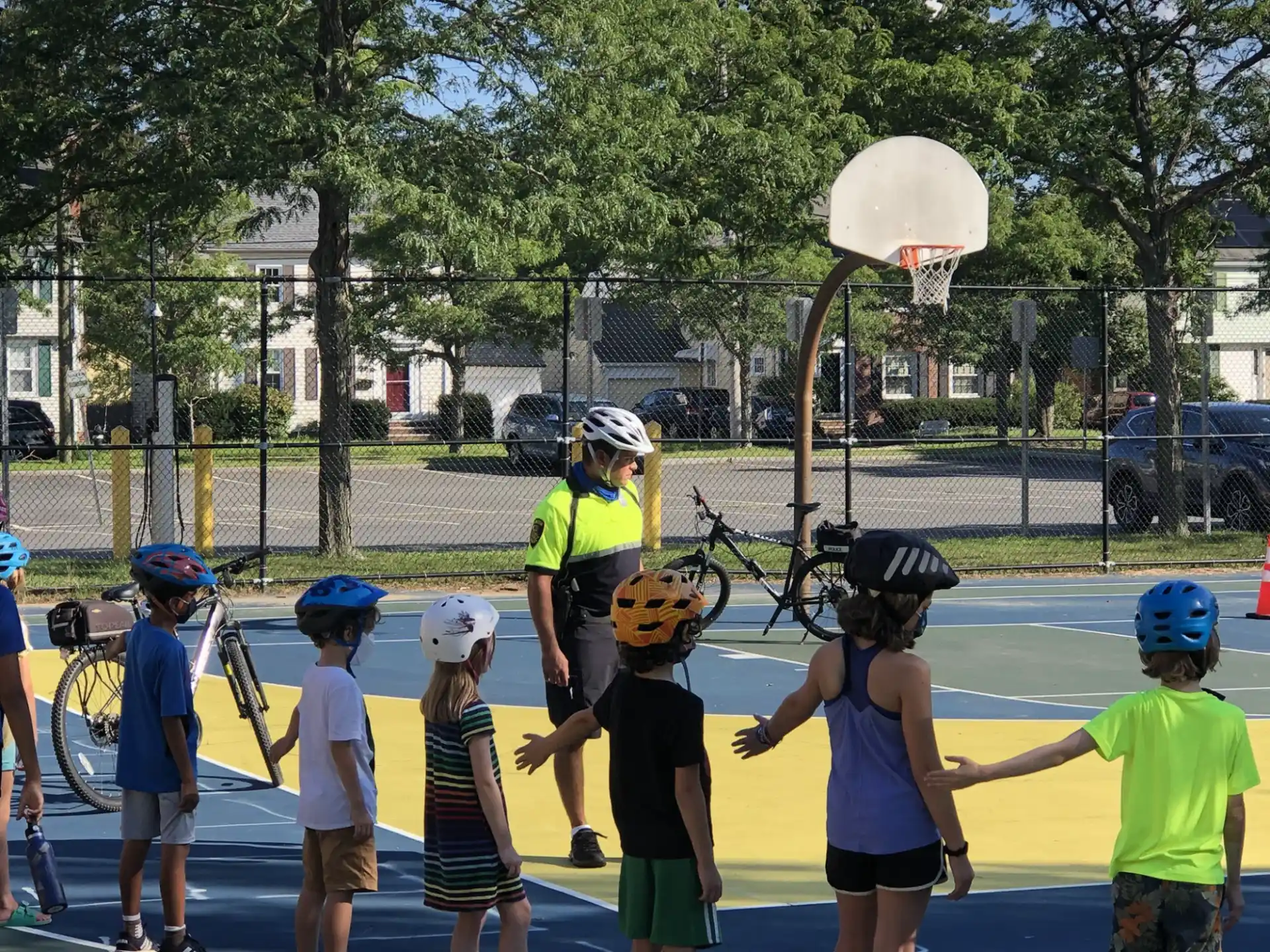 a group of kids playing basketball