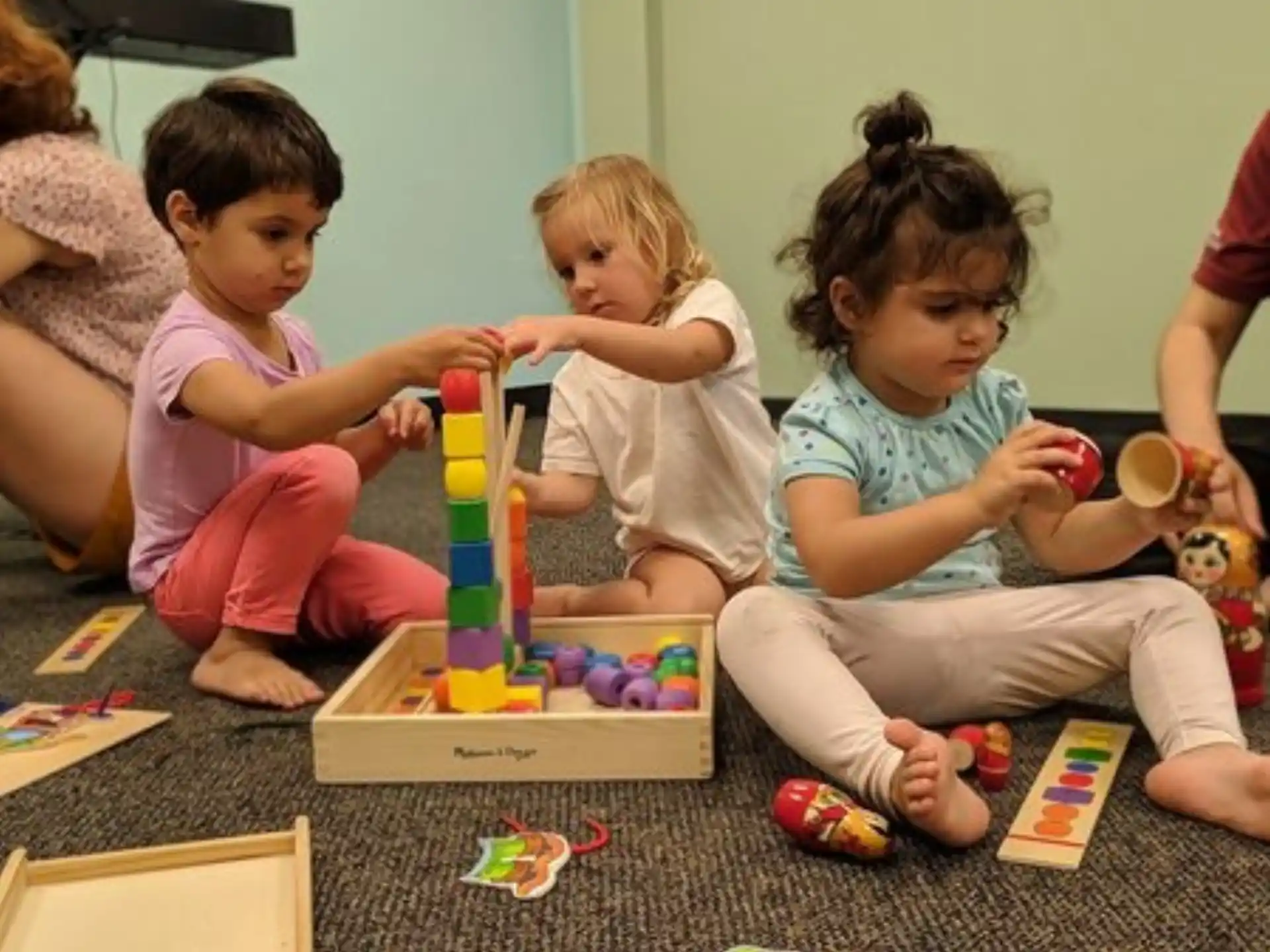 a group of children playing with toys