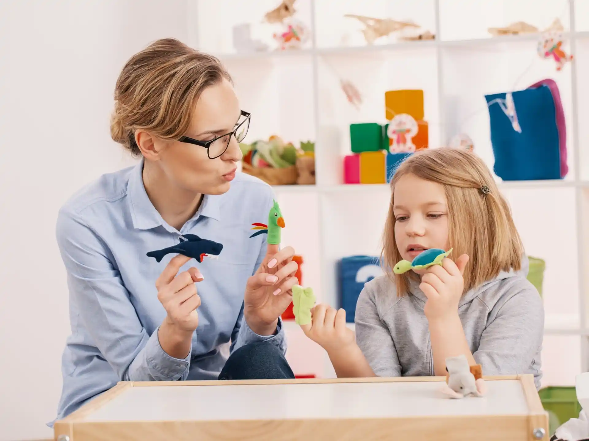 a person and a girl brushing their teeth
