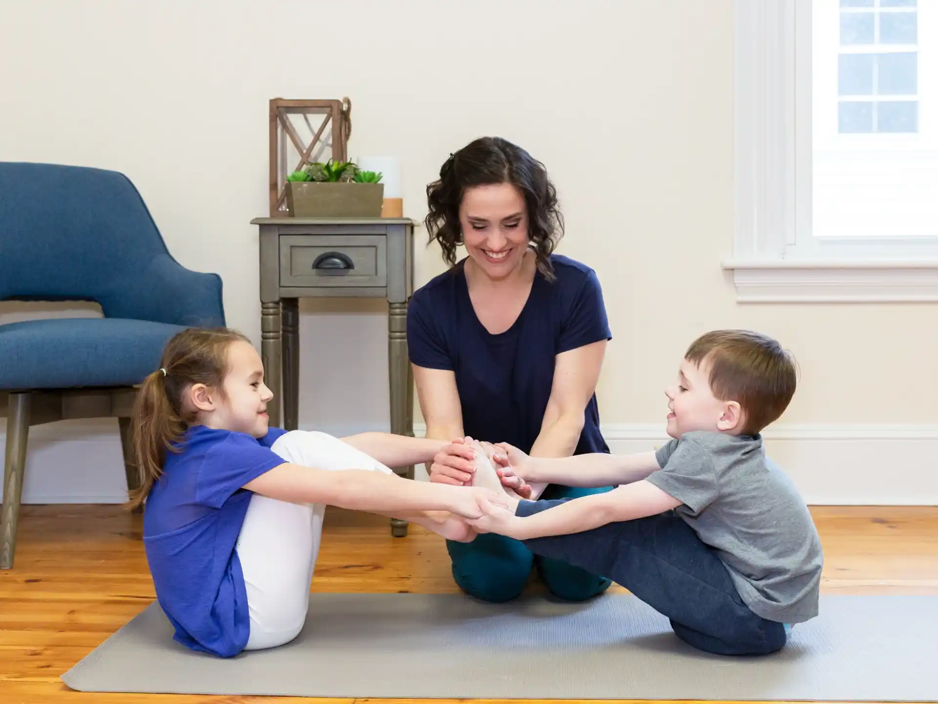 a person and several children sitting on the floor