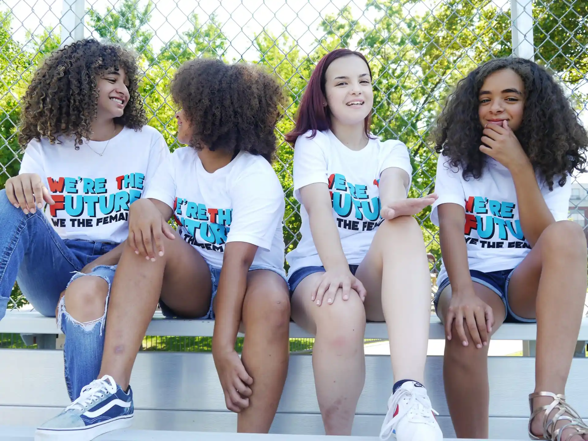 a group of people sitting on a bench