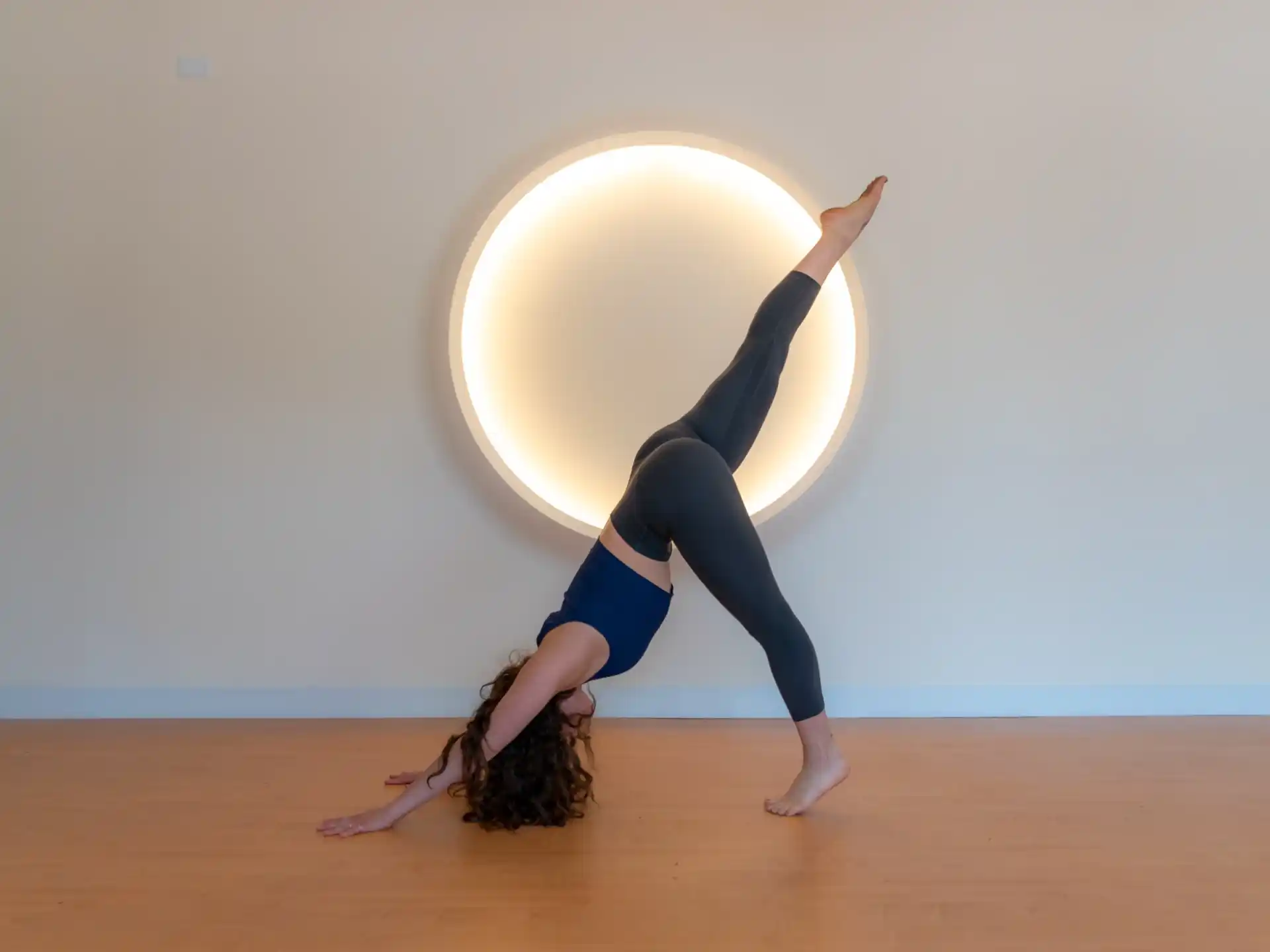 a woman doing a yoga pose