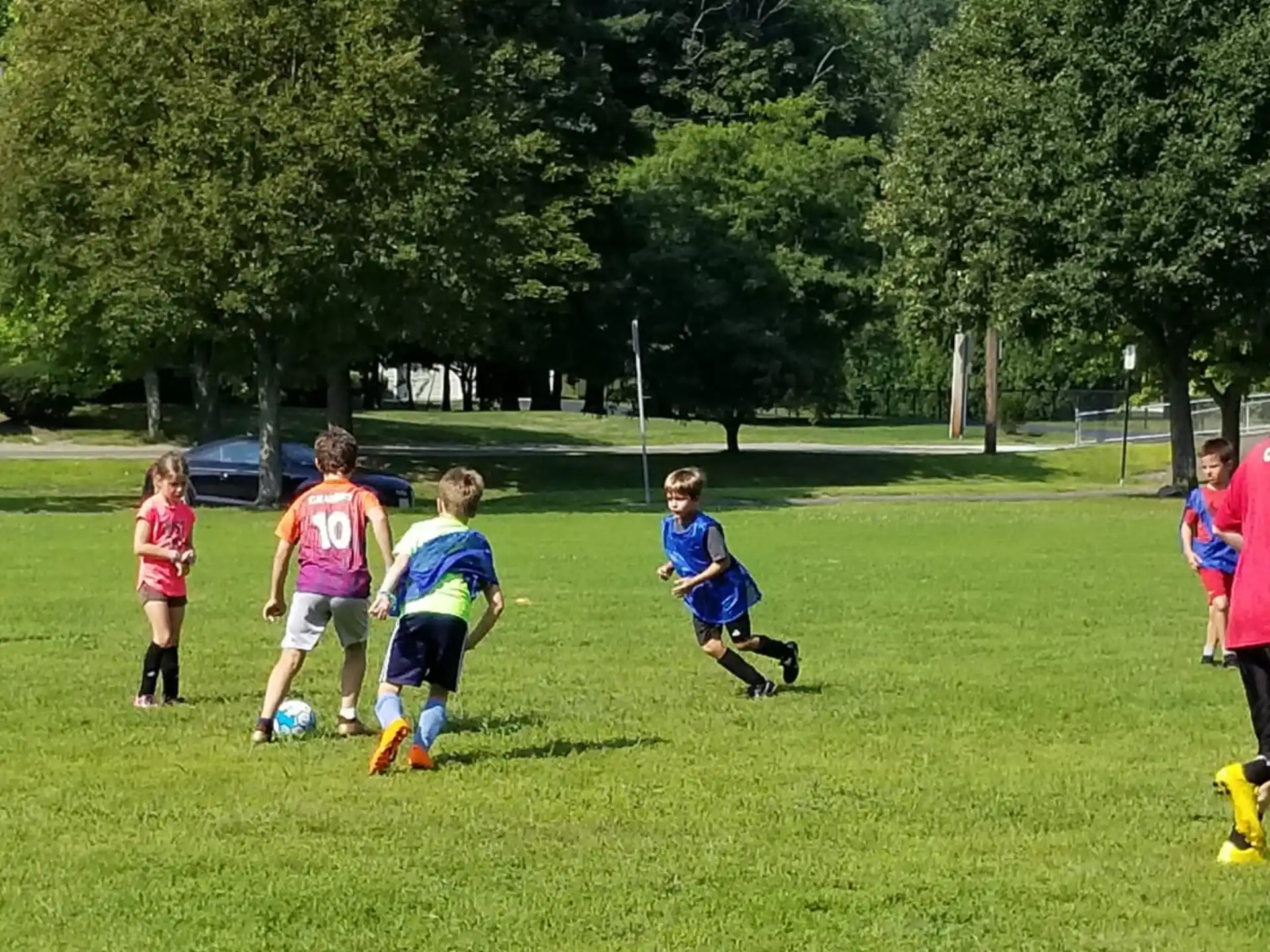 a group of kids playing football