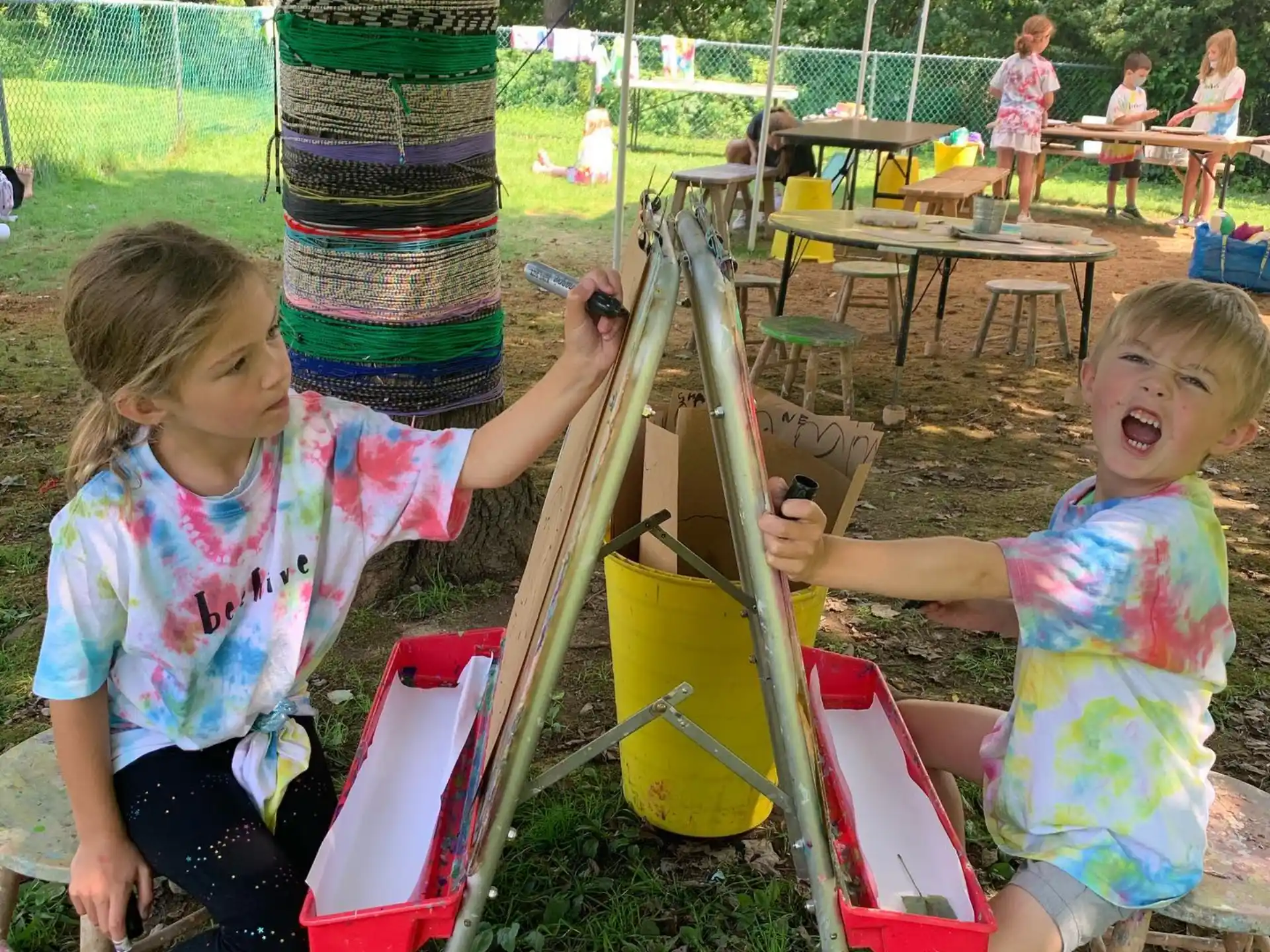 a couple of children playing on a playground