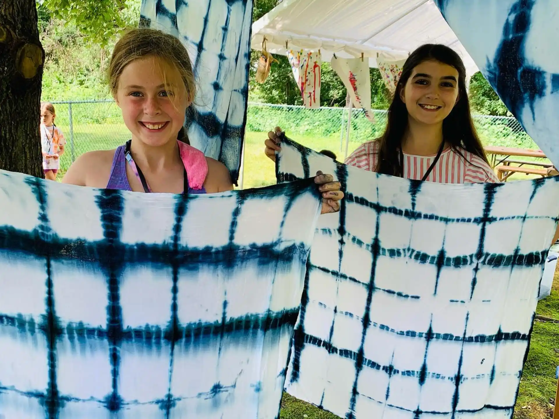a person holding a quilt