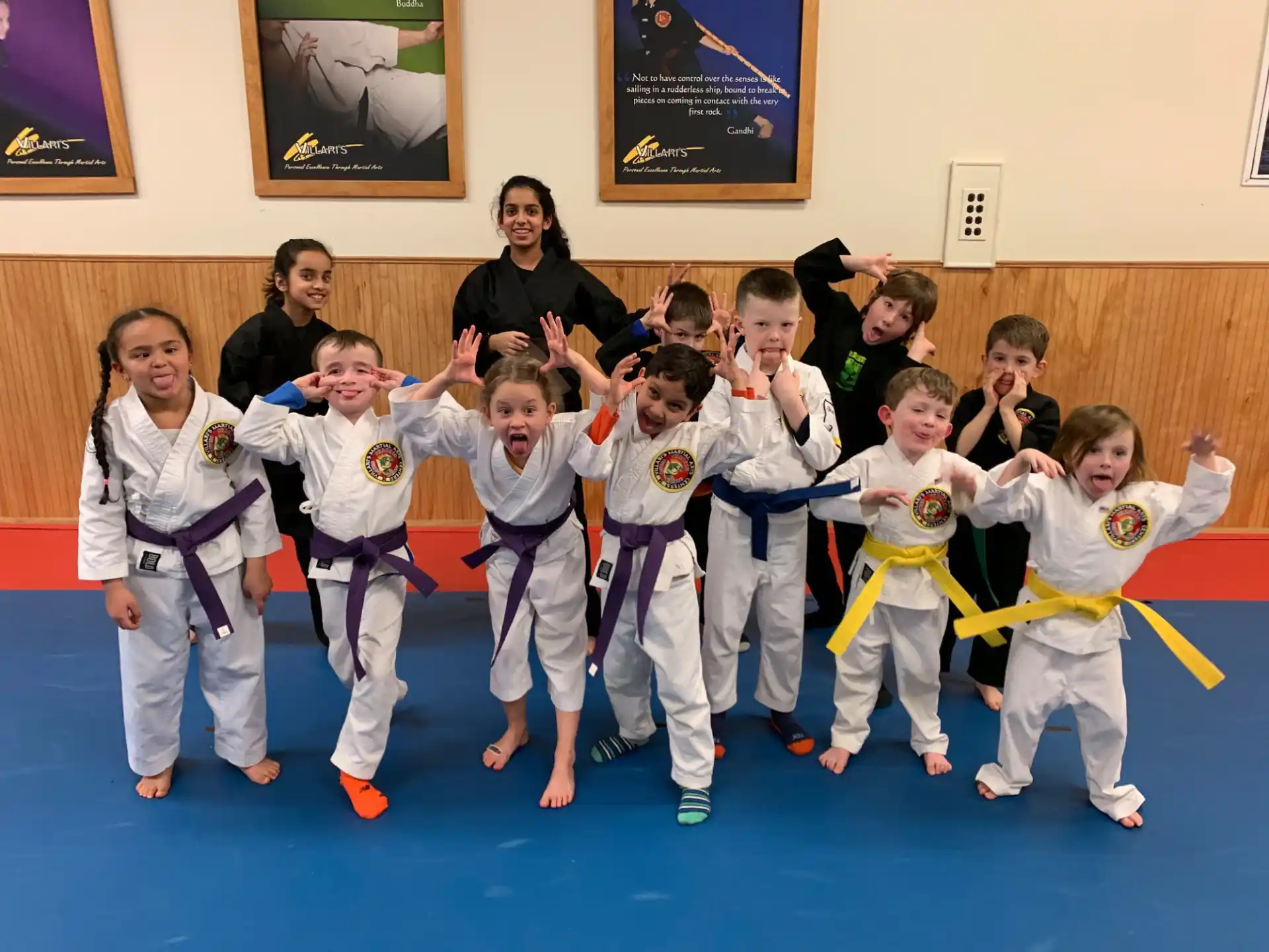 a group of children in karate uniforms