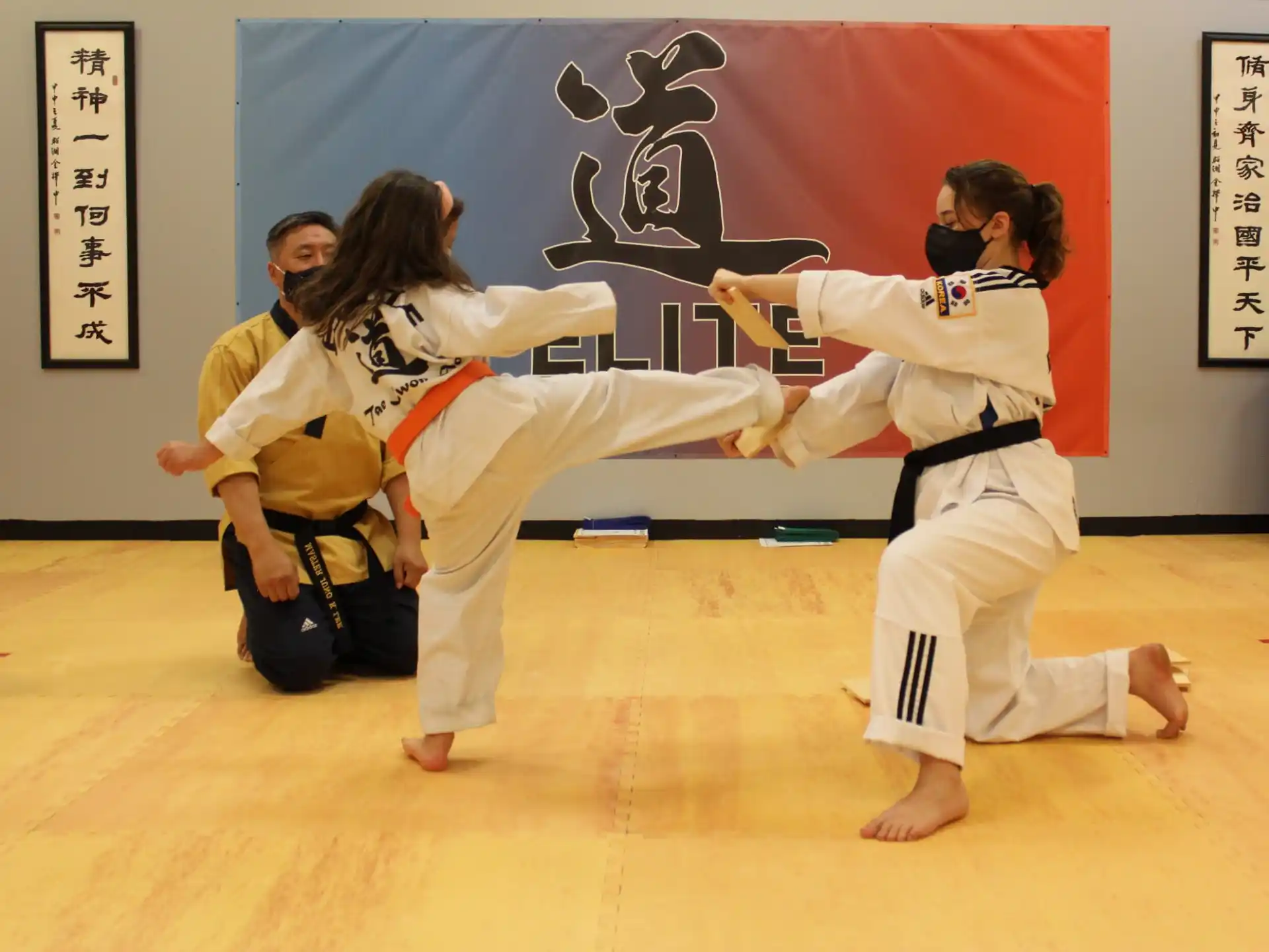 a group of people in karate uniforms