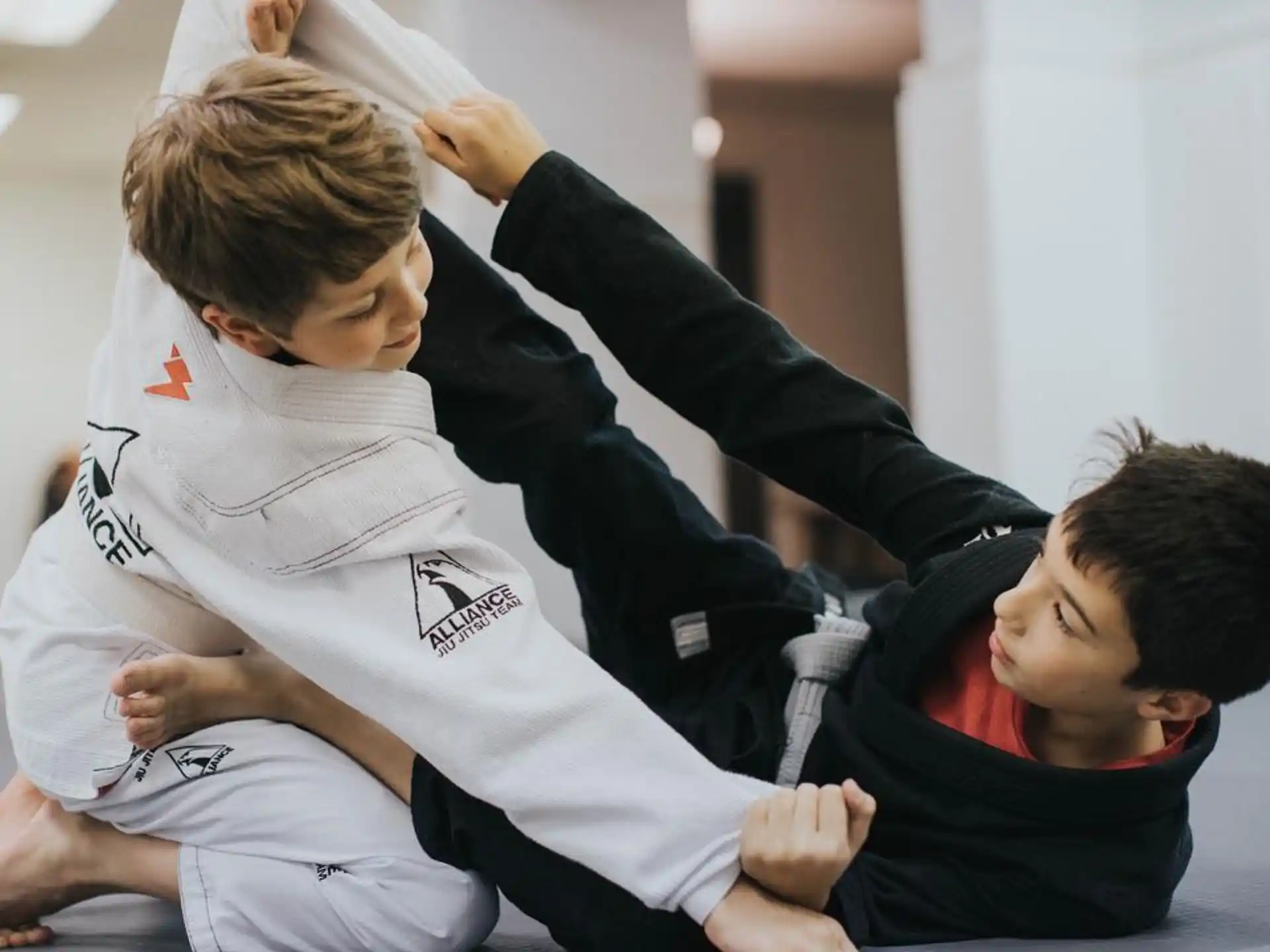 a few boys in karate uniforms