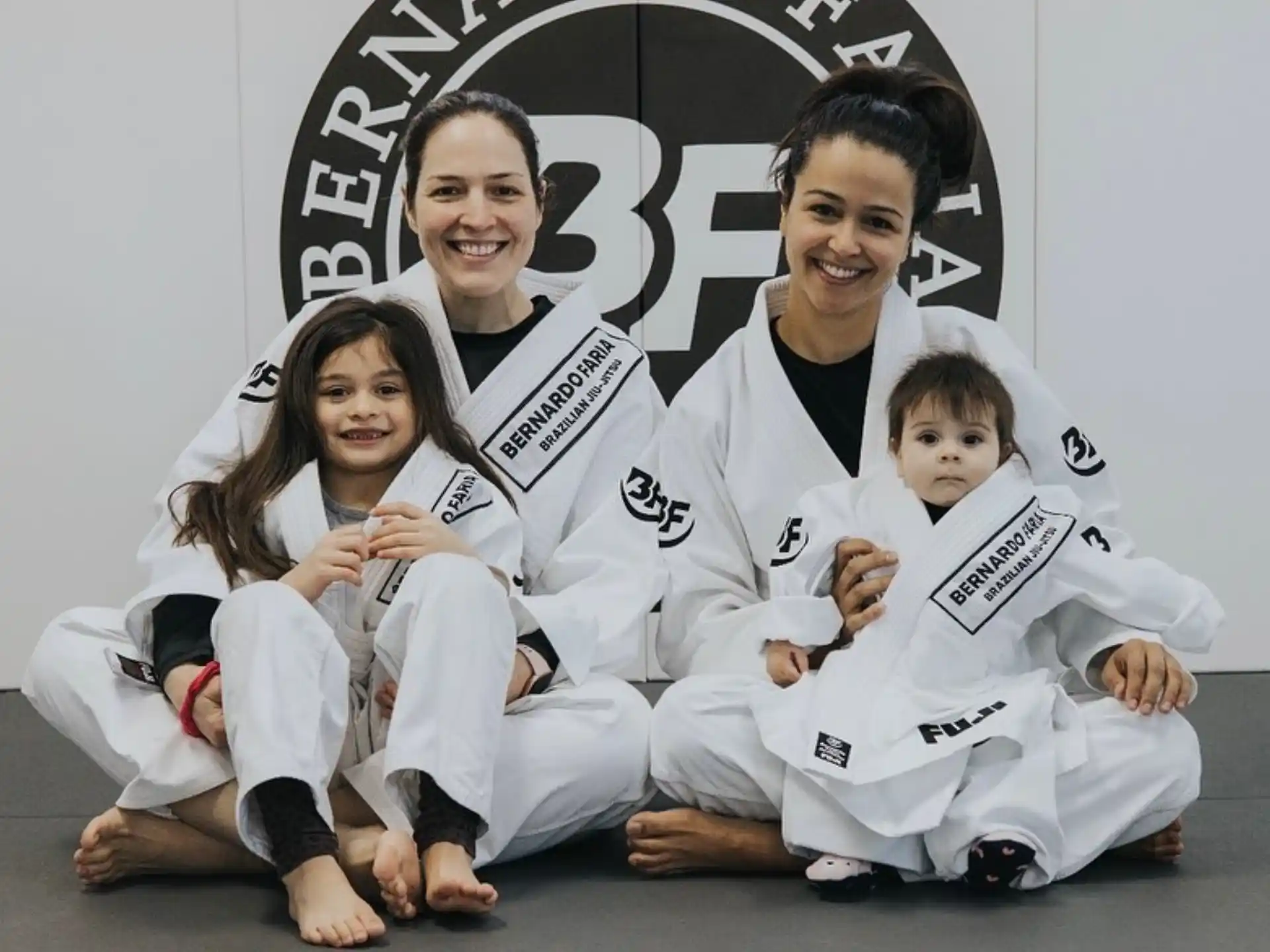 a group of people in karate uniforms