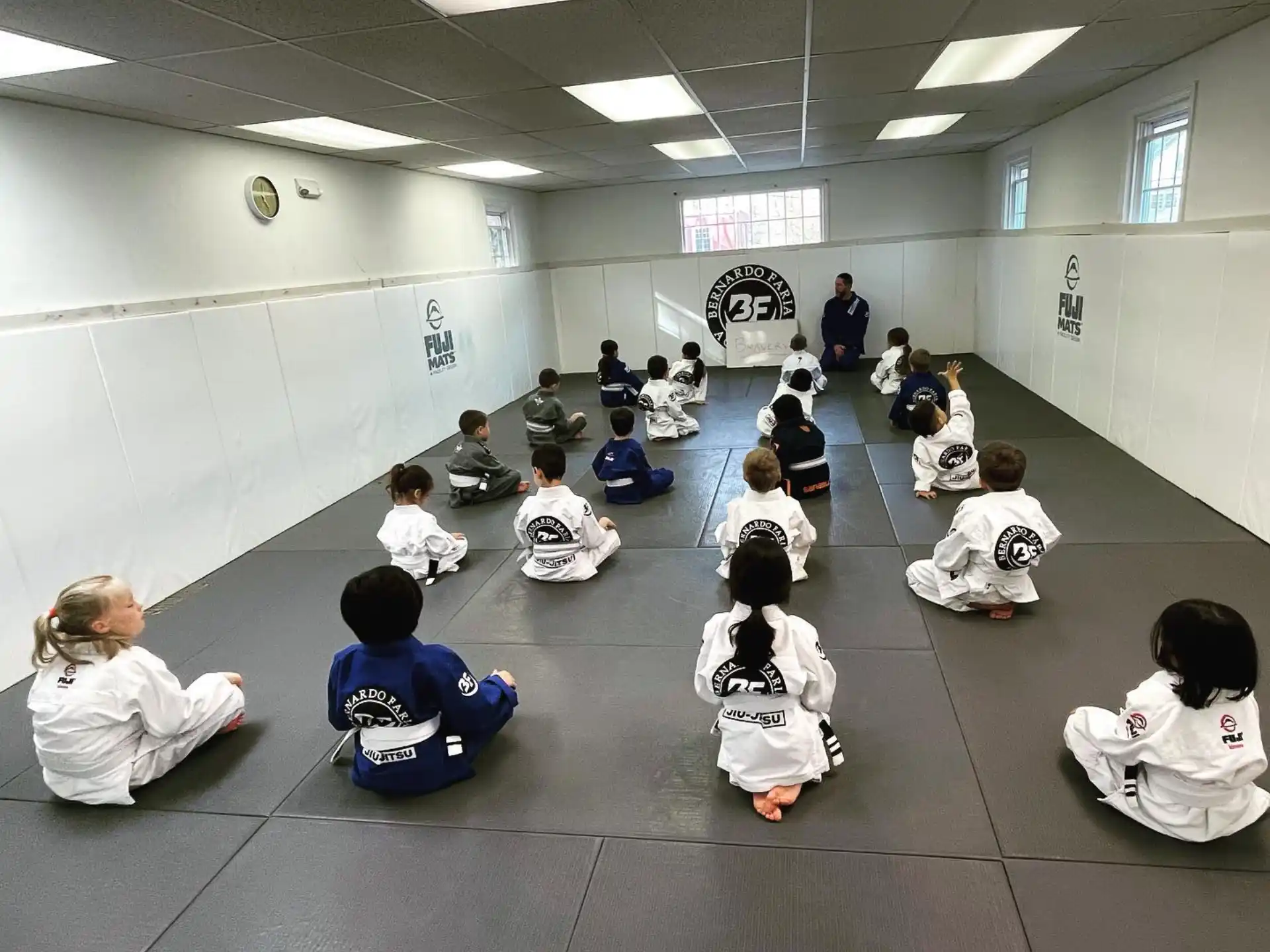 a group of people sitting in a circle in a room