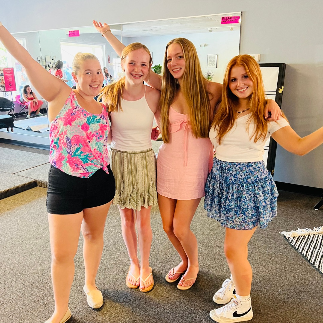 a group of women posing for a photo