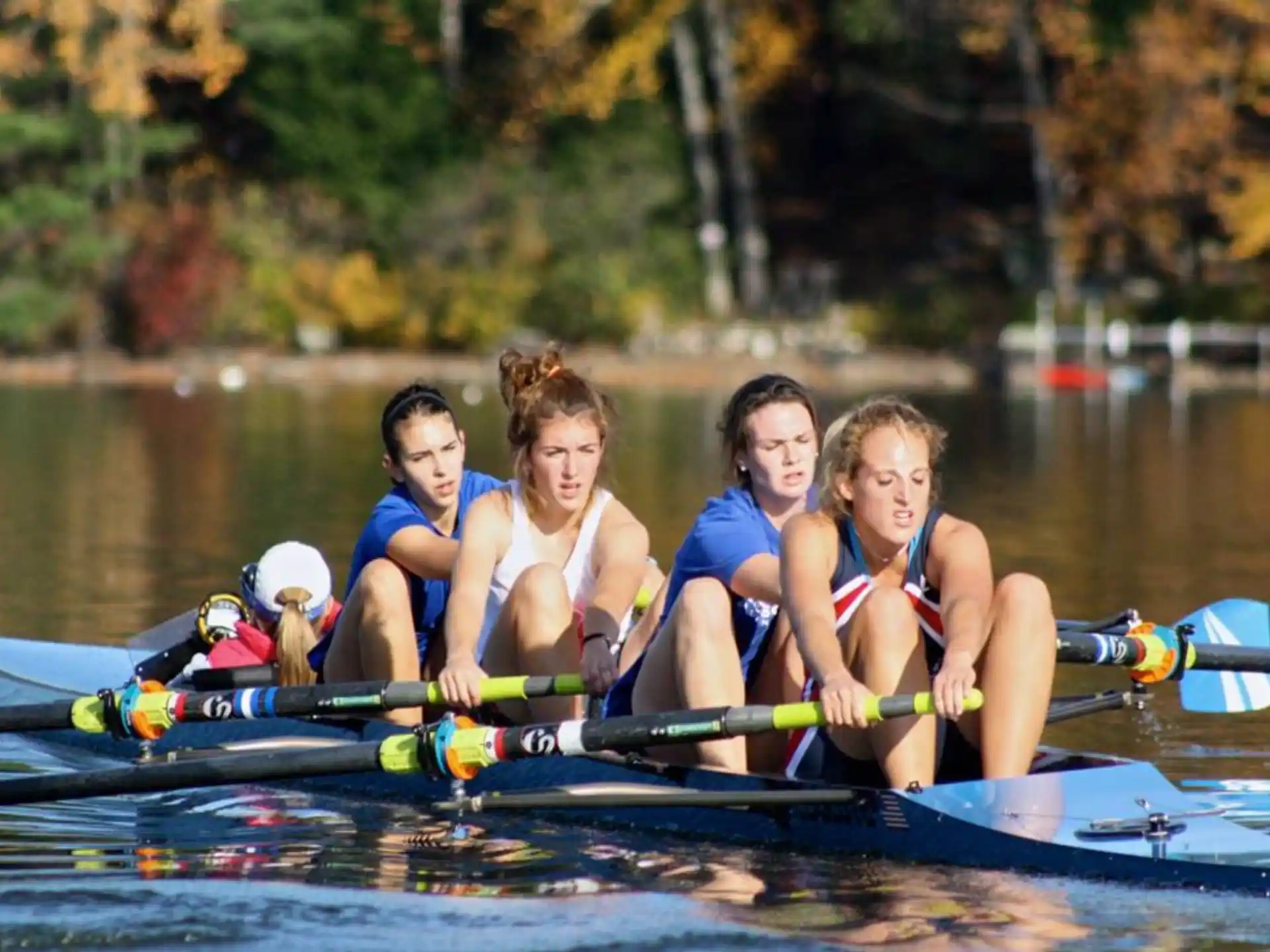 a group of women rowing a boat