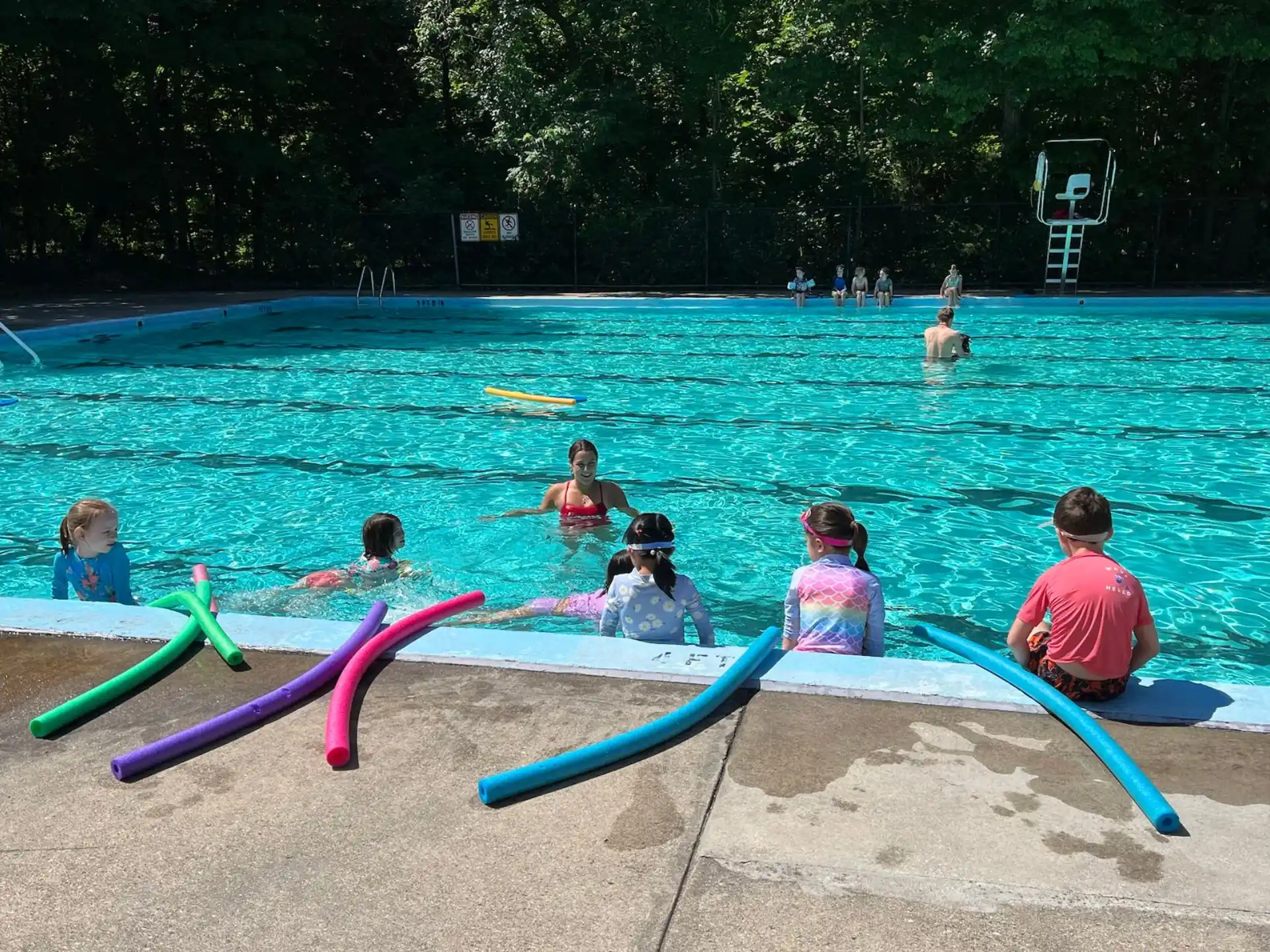 a group of people in a pool