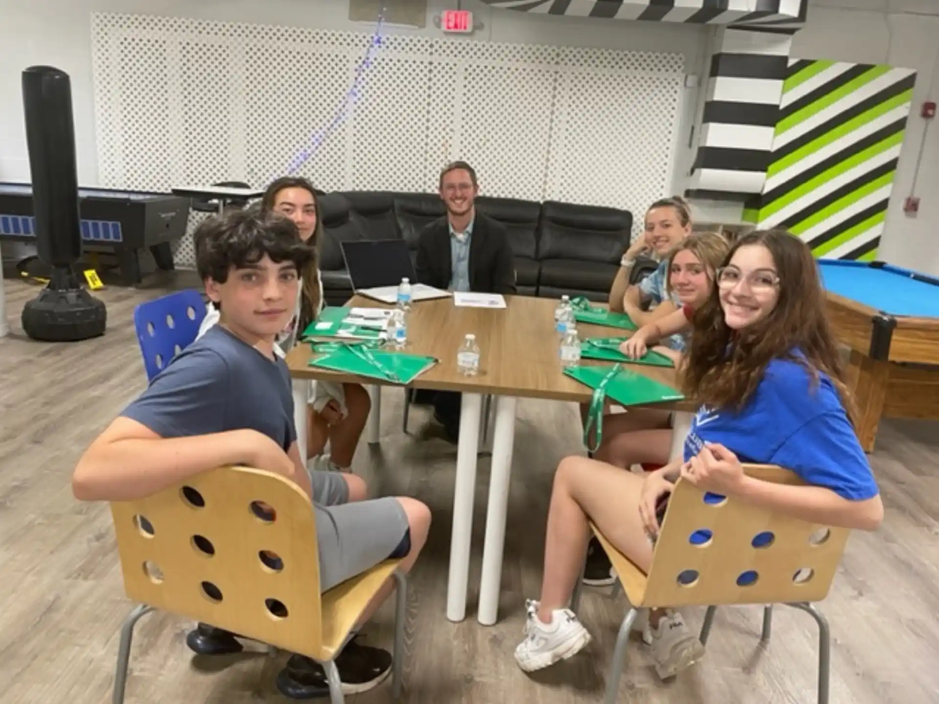 a group of people sitting at a table