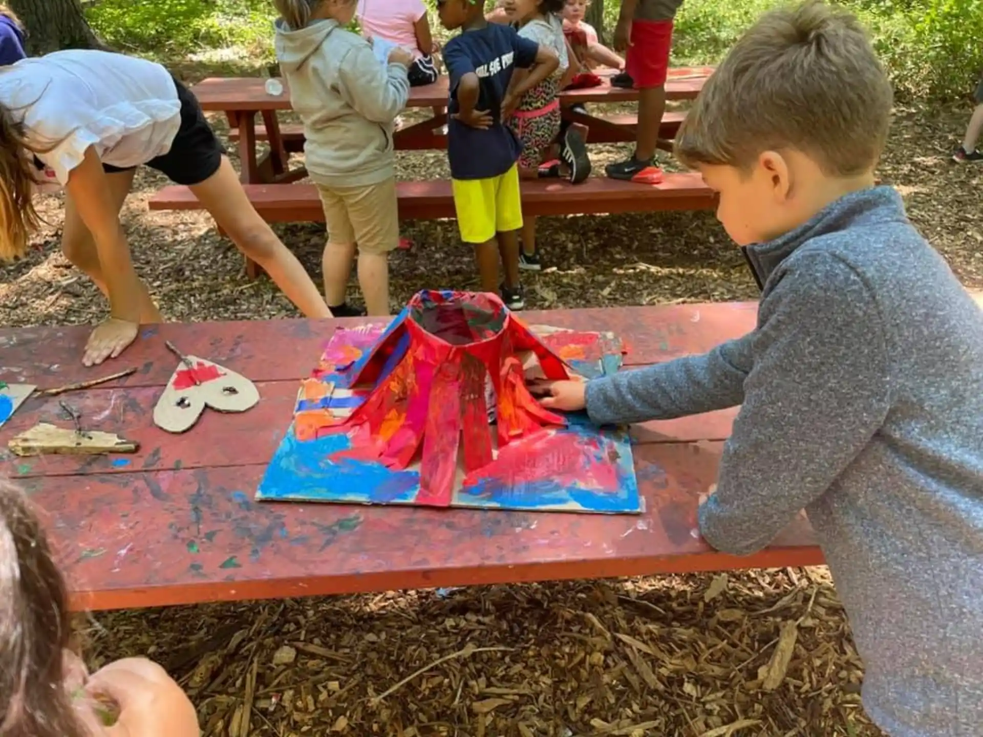a group of children painting