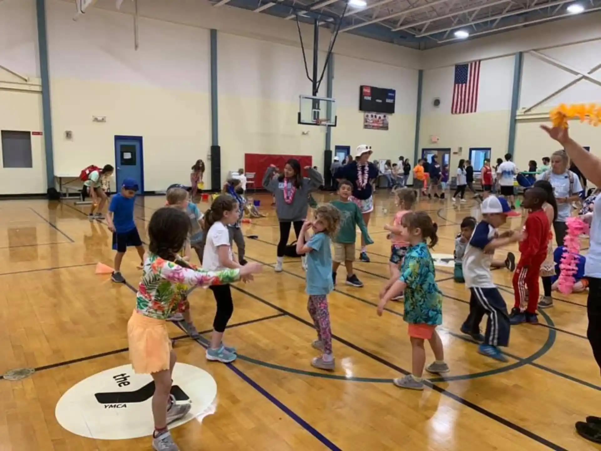 a group of children playing basketball
