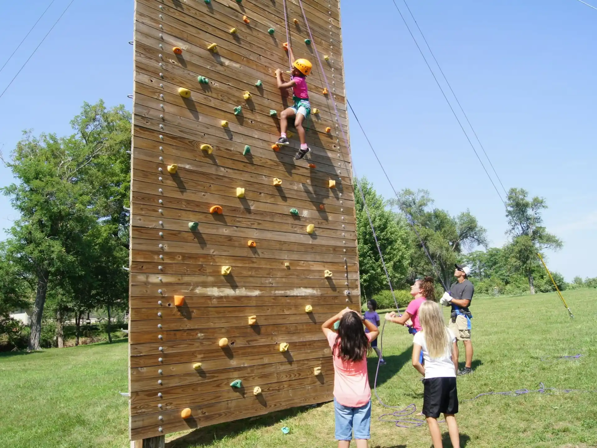 a group of people playing on a wooden structure