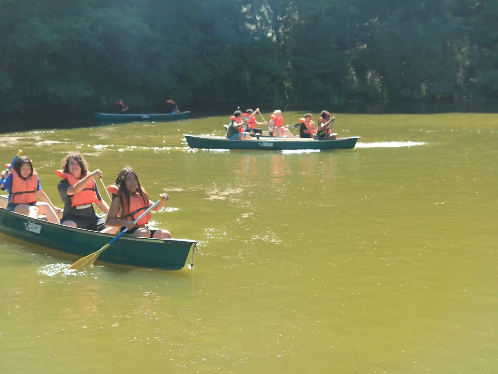 a group of people rowing a boat