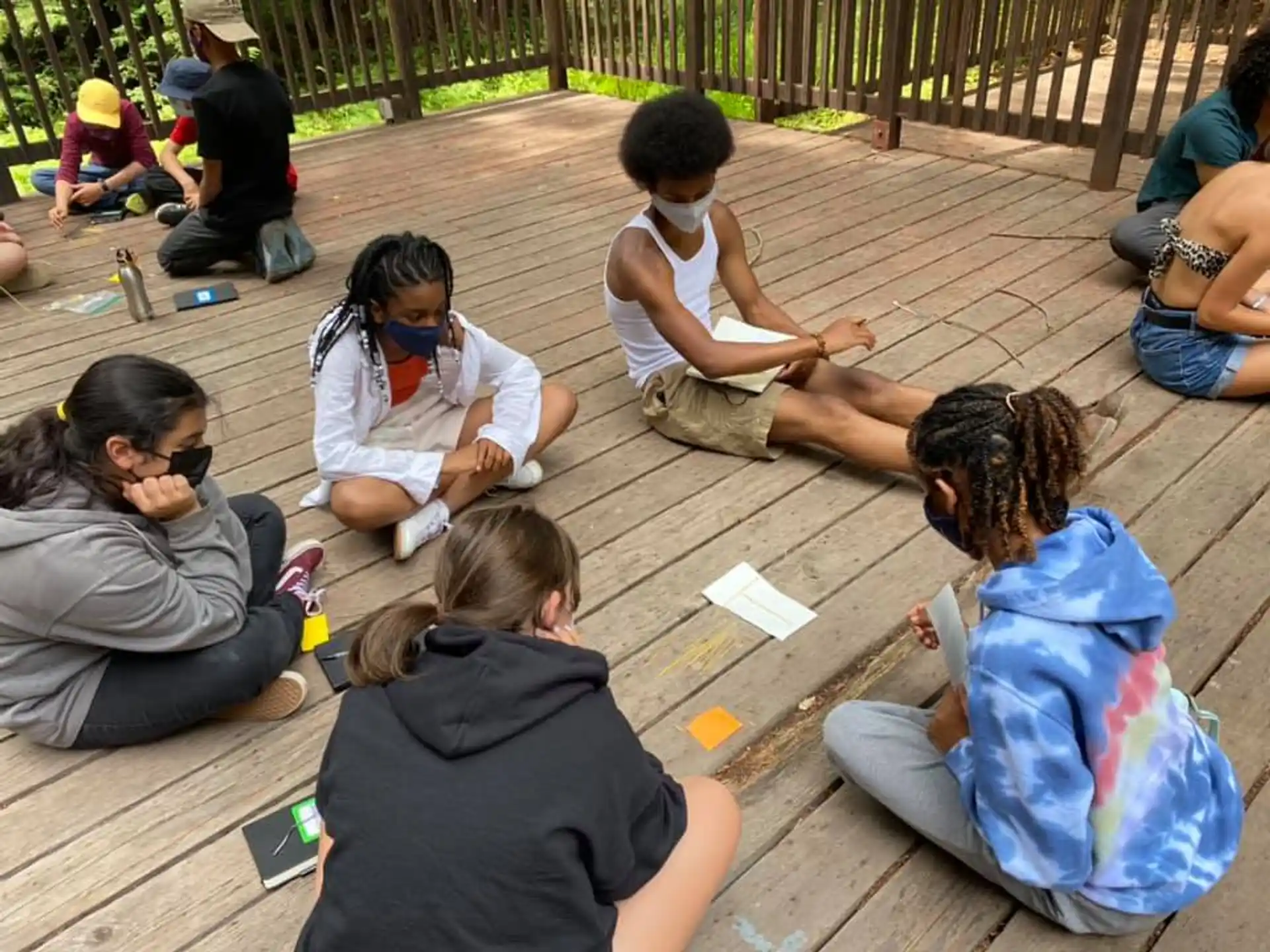 a group of people sitting on the ground