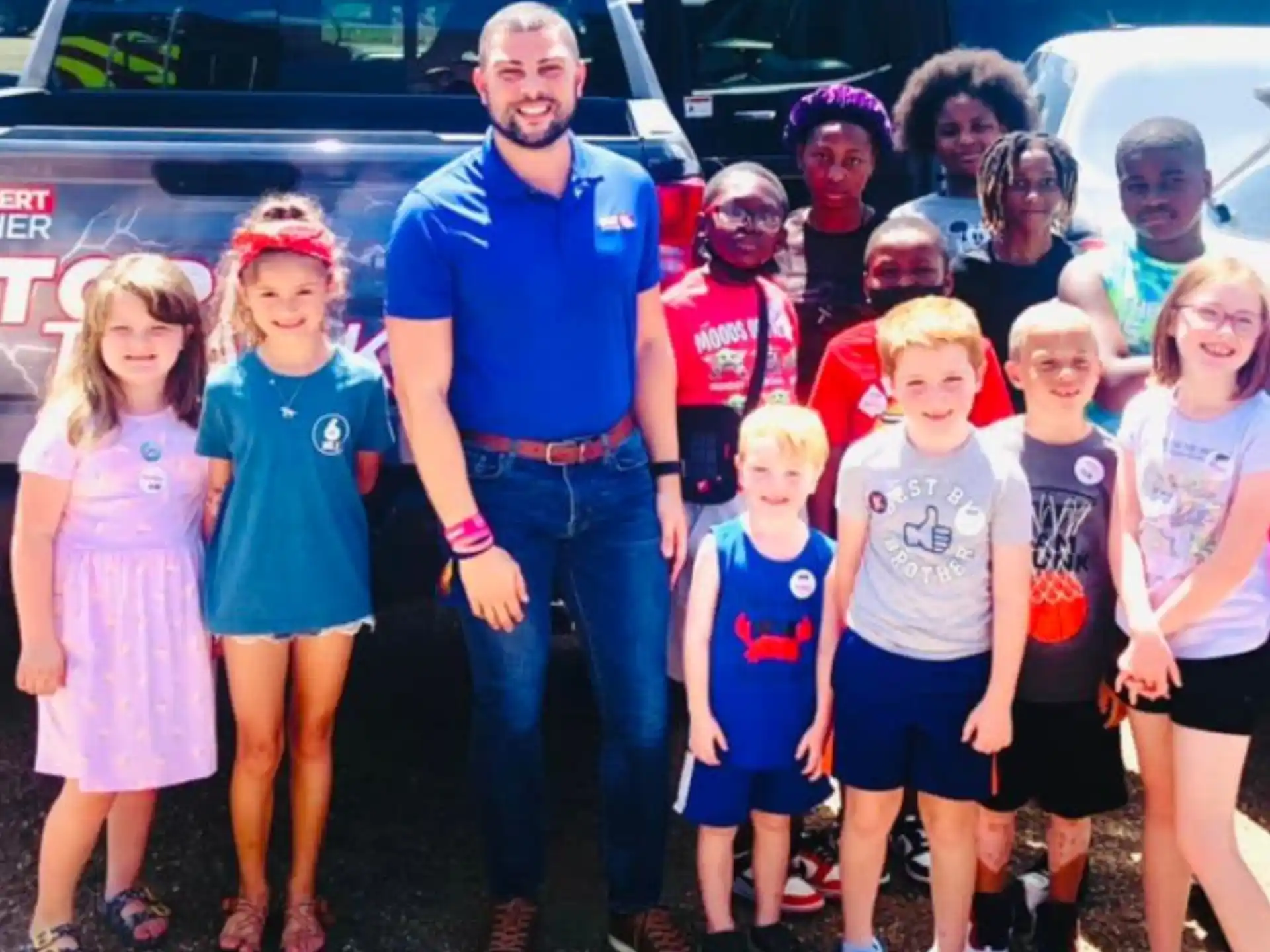 a woman standing with a group of children
