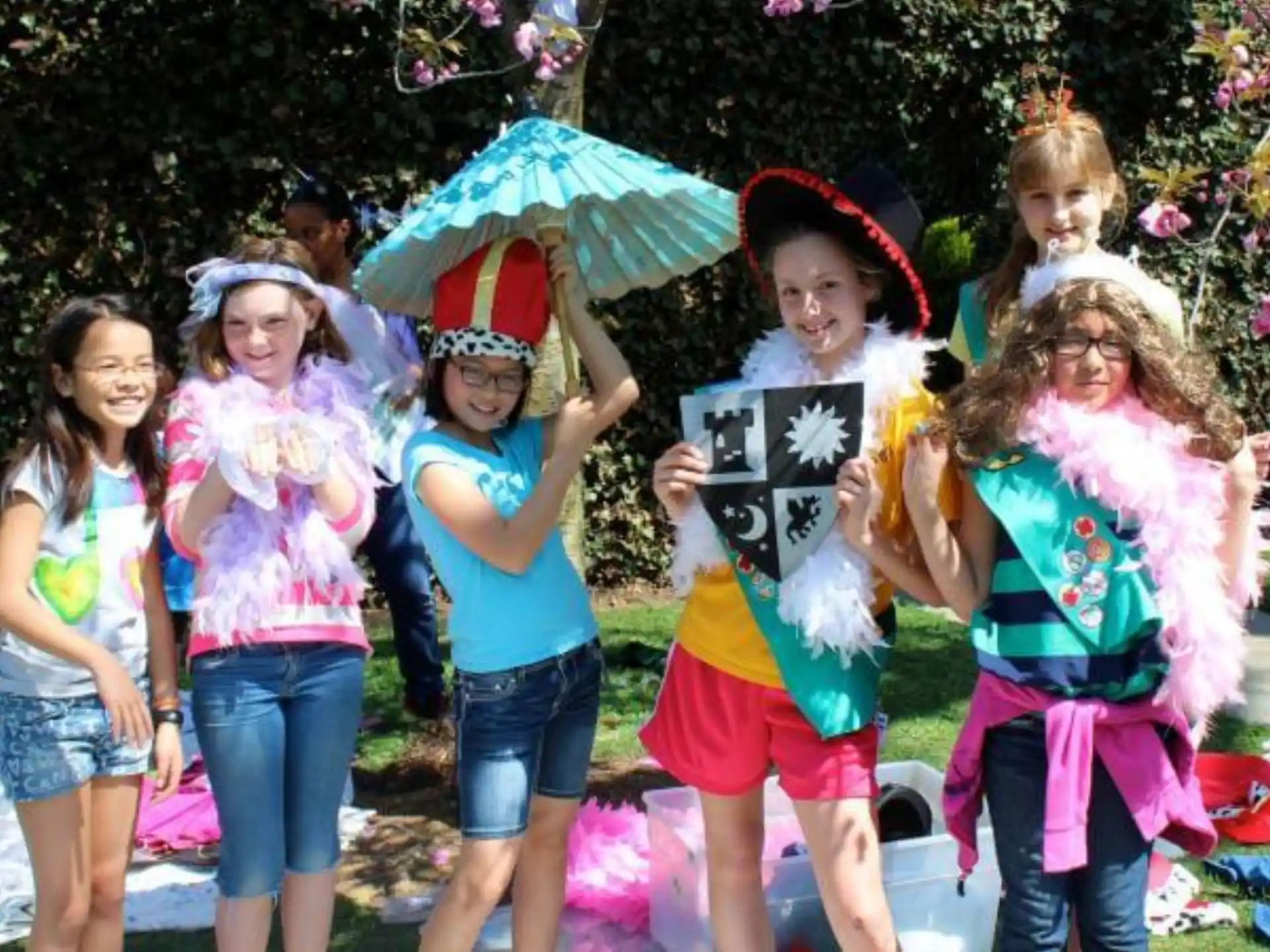 a group of children holding umbrellas