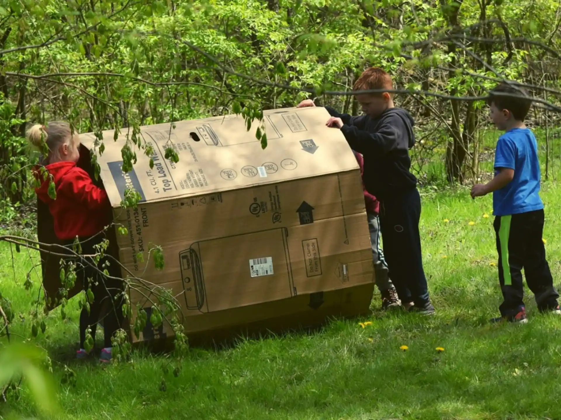 a group of people carrying boxes