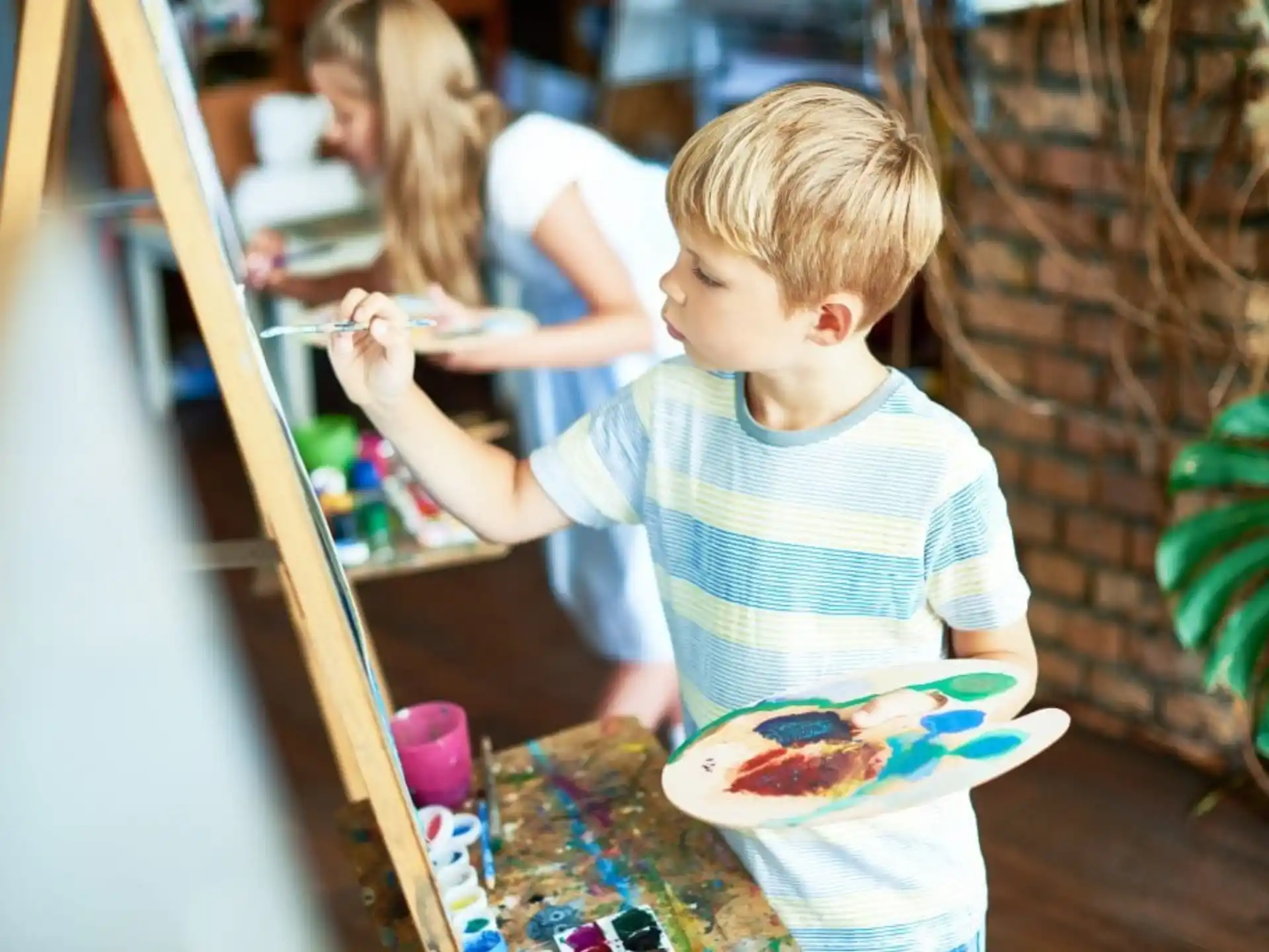 a young boy painting