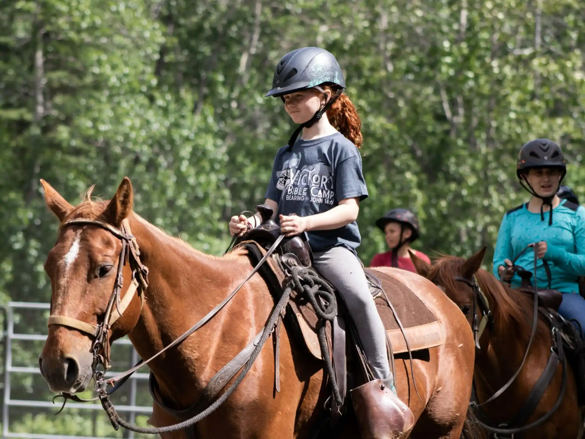 a group of people riding horses