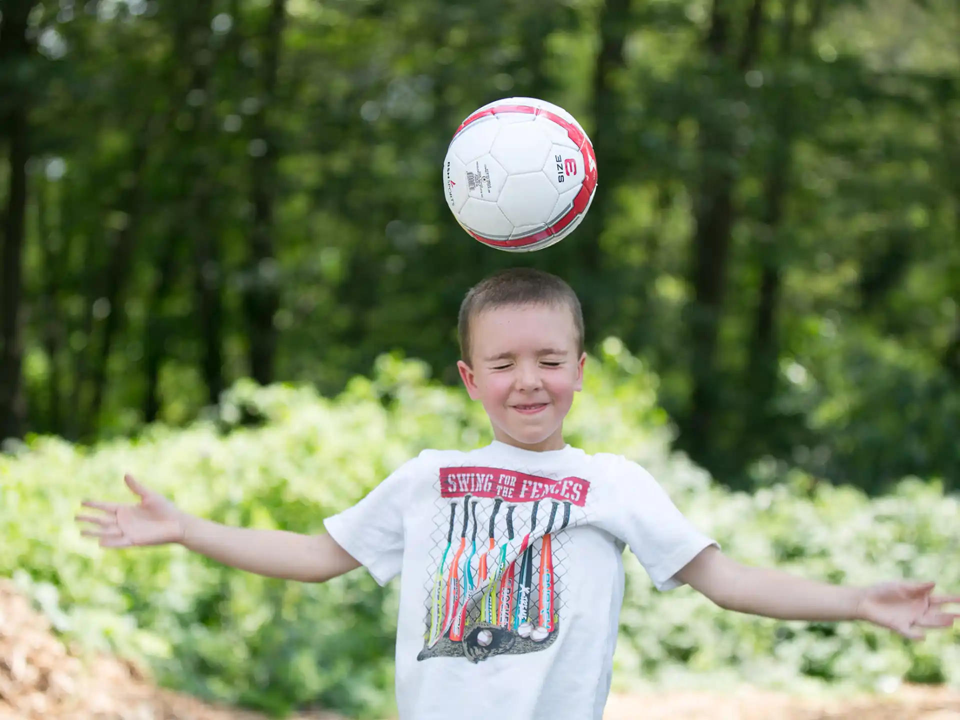 a boy throwing a ball
