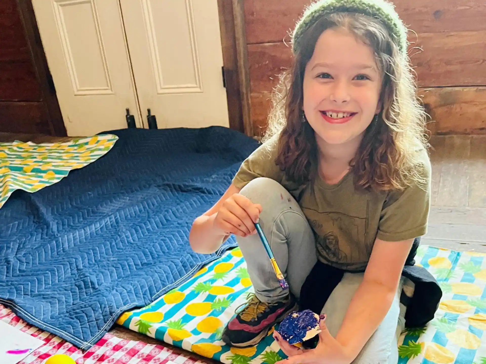 a girl holding a toy