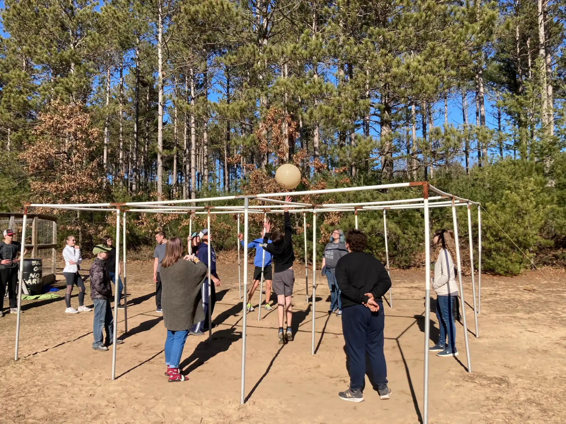 a group of people playing volleyball