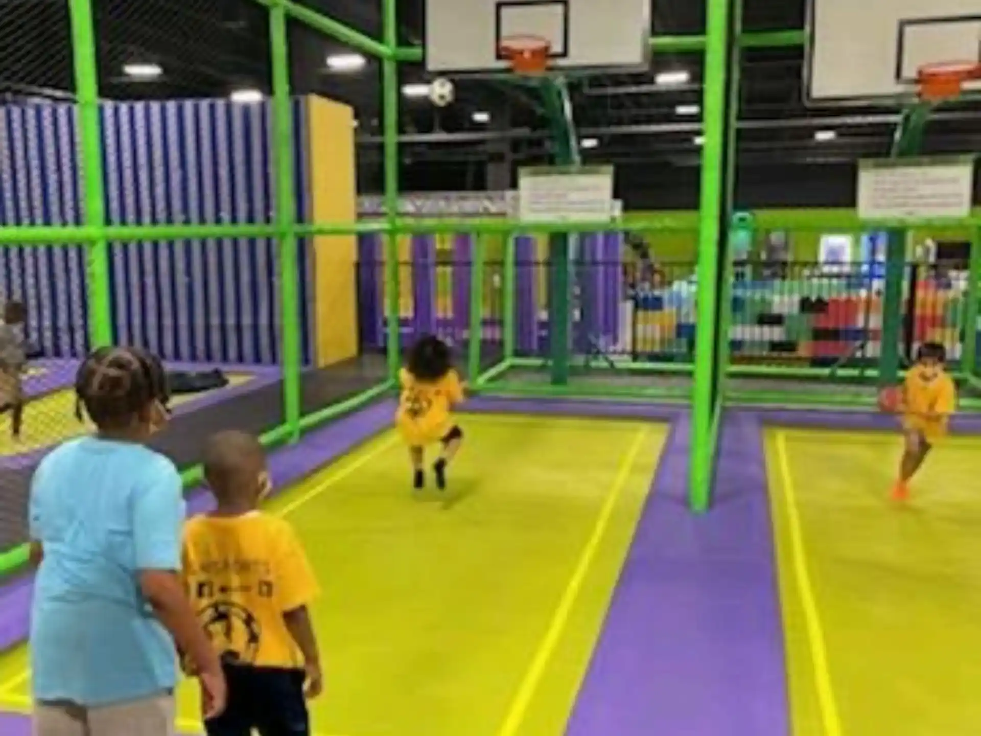kids playing basketball in a gym