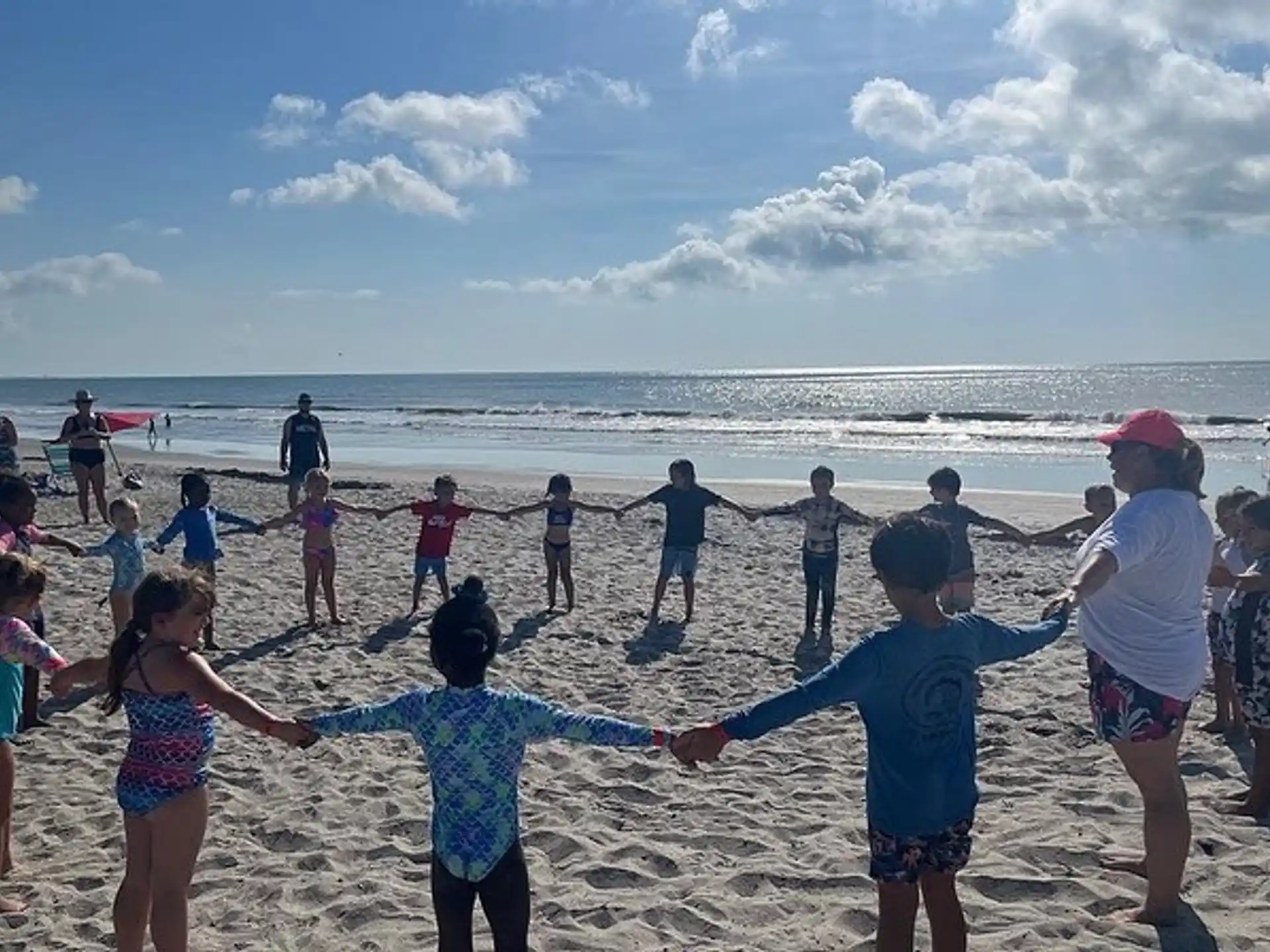 a group of people on a beach