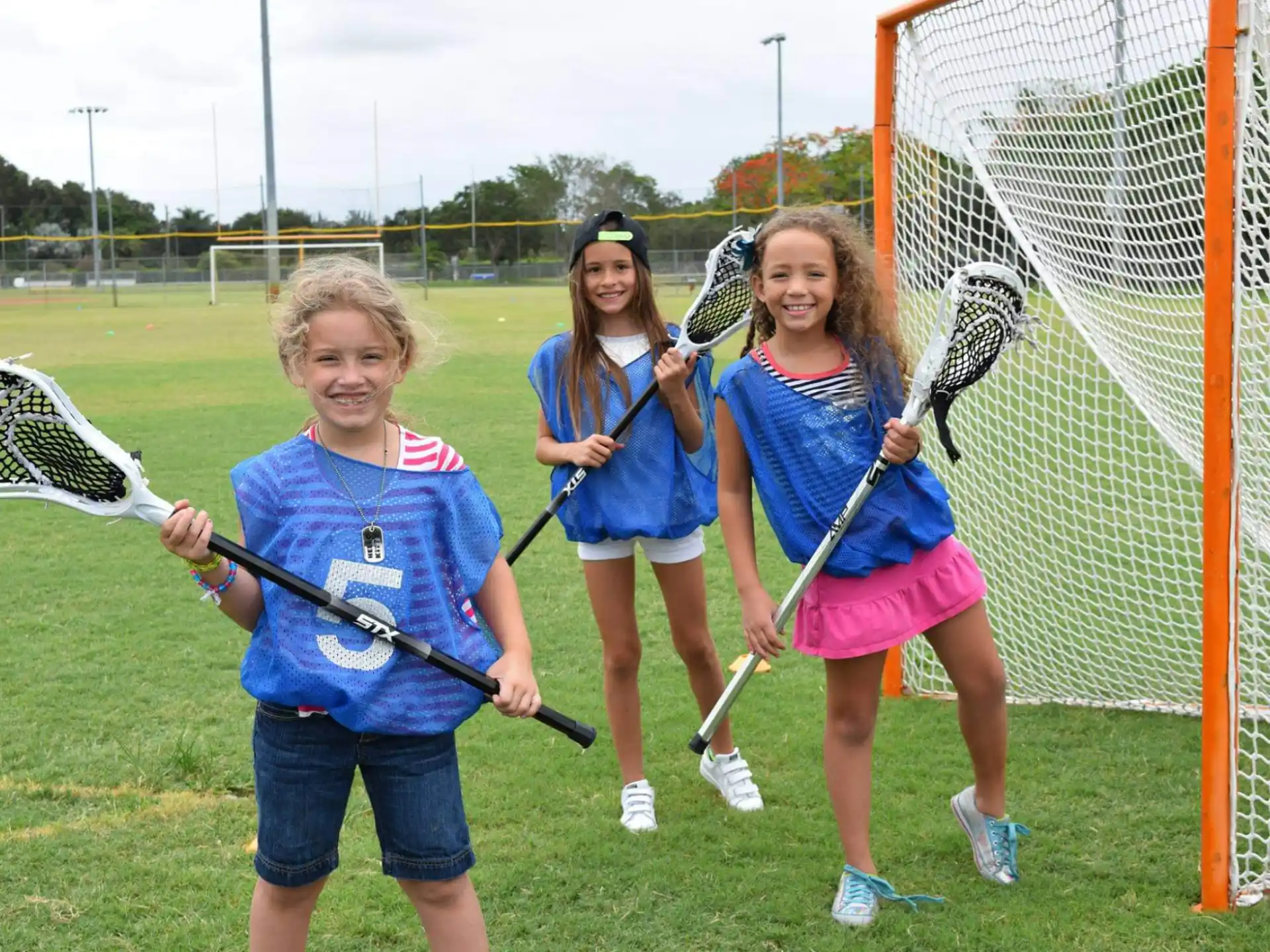 a group of girls holding bows and arrows
